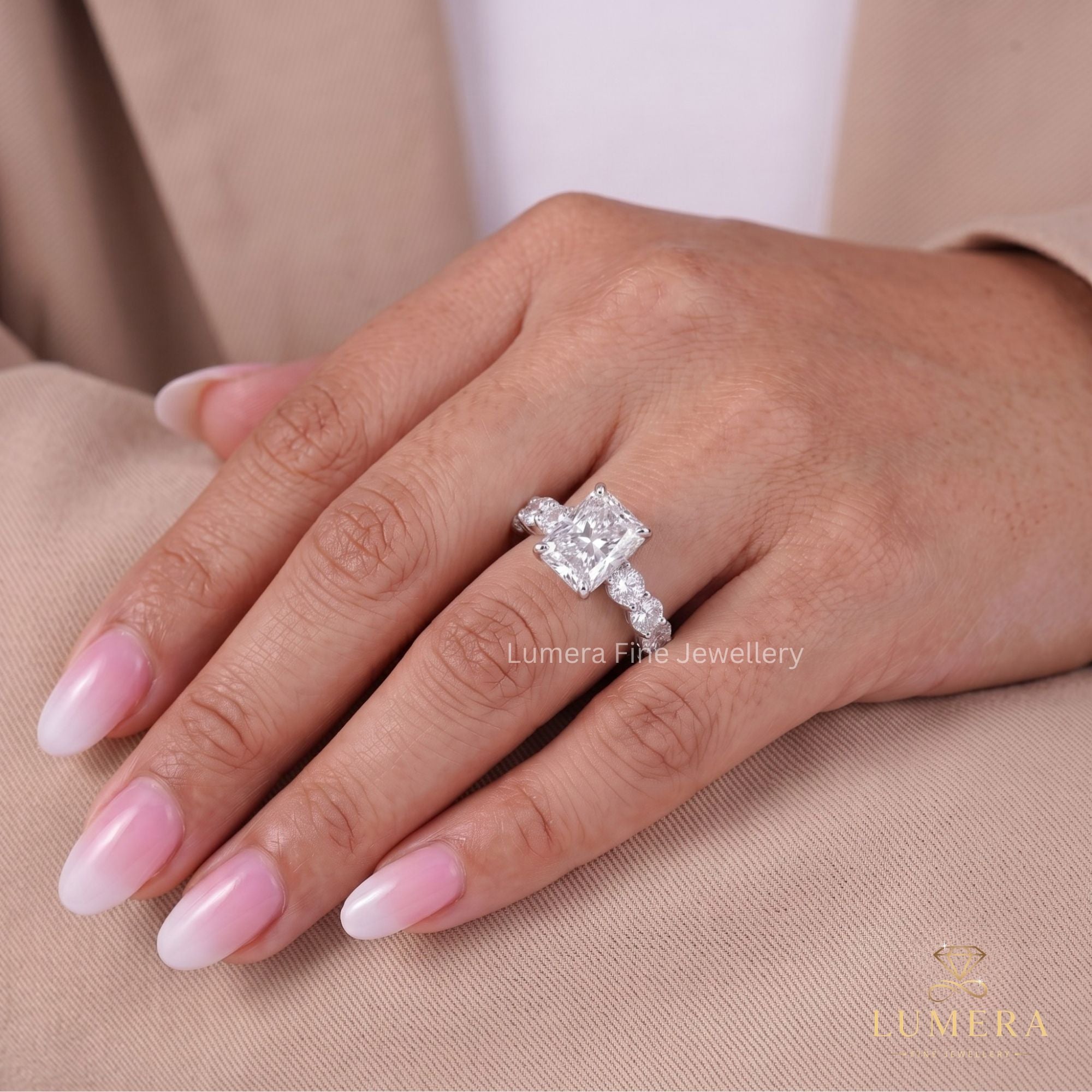Hidden halo ring with claw prong setting.
