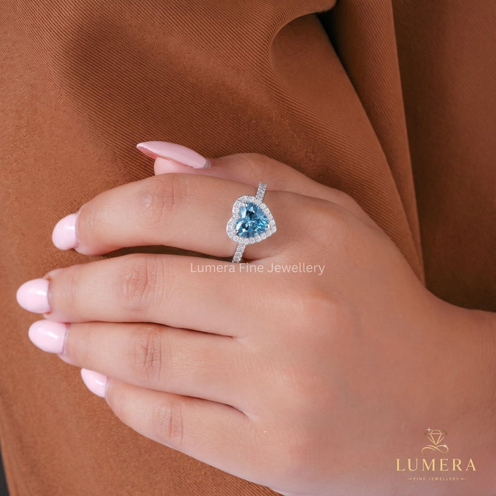 Blue diamond ring with halo engagement ring.
