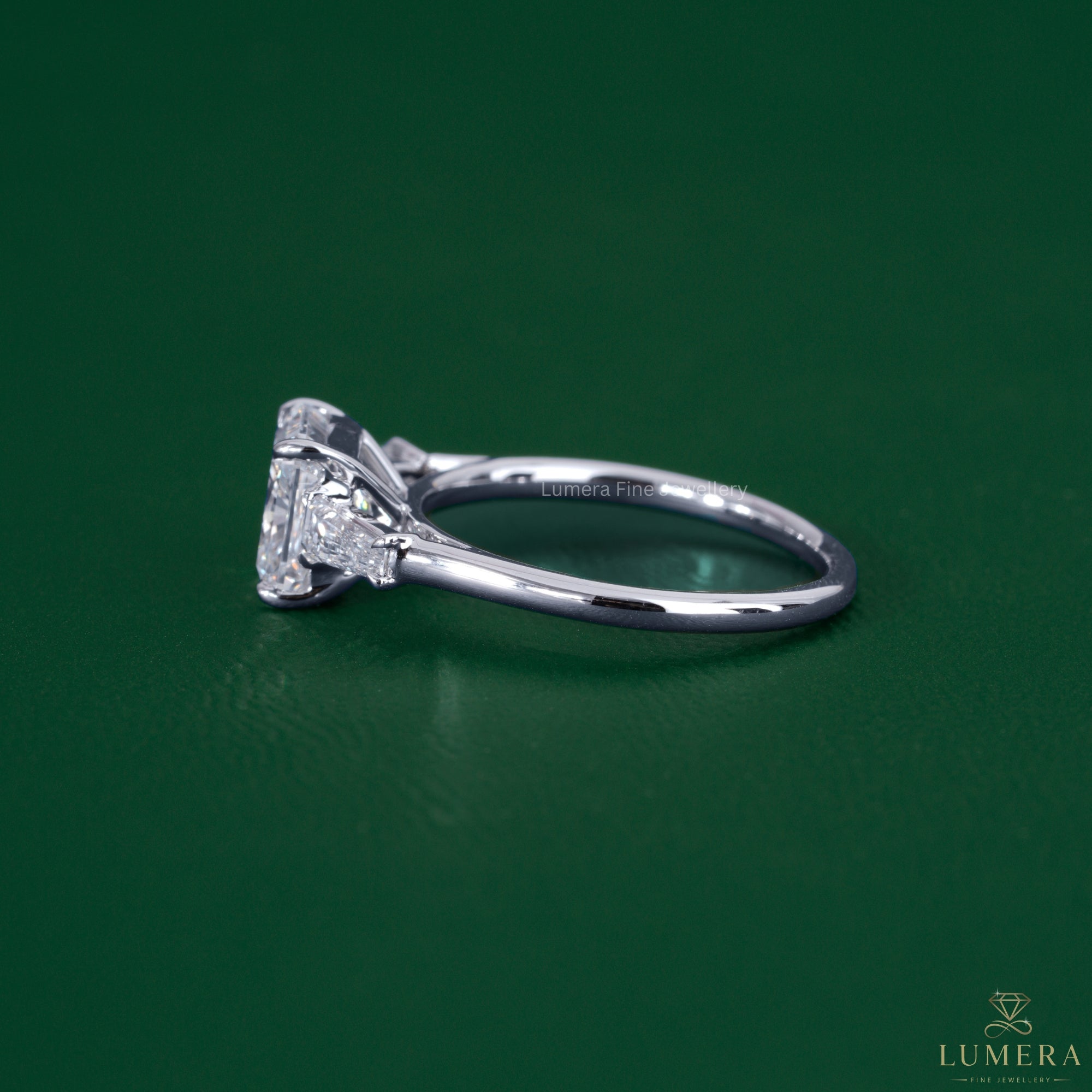 Three stone engagement ring featuring a claw prong setting.