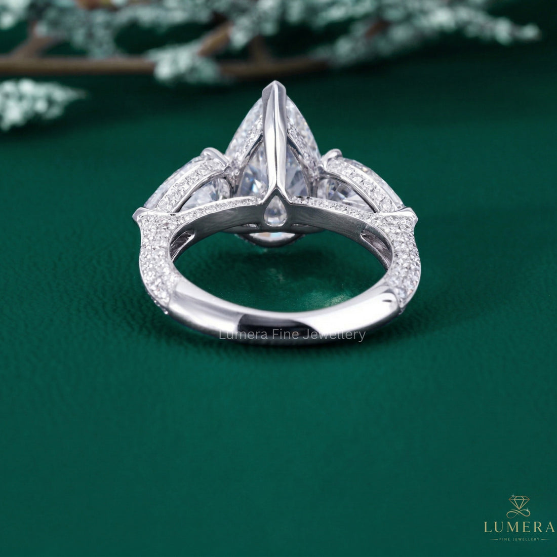 pear side stones with hidden halo engagement ring.