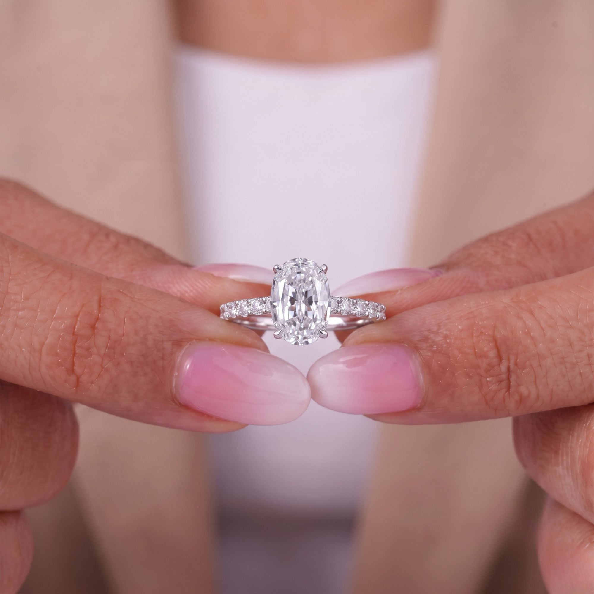Hidden halo engagement ring with stackable pave setting.