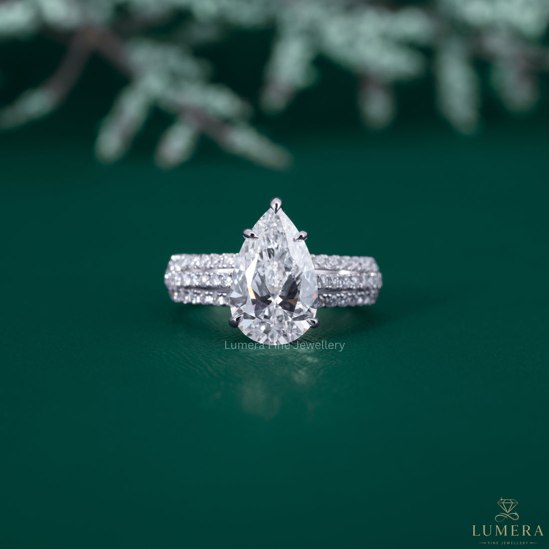 Pave engagement ring with pear diamond engagement ring.