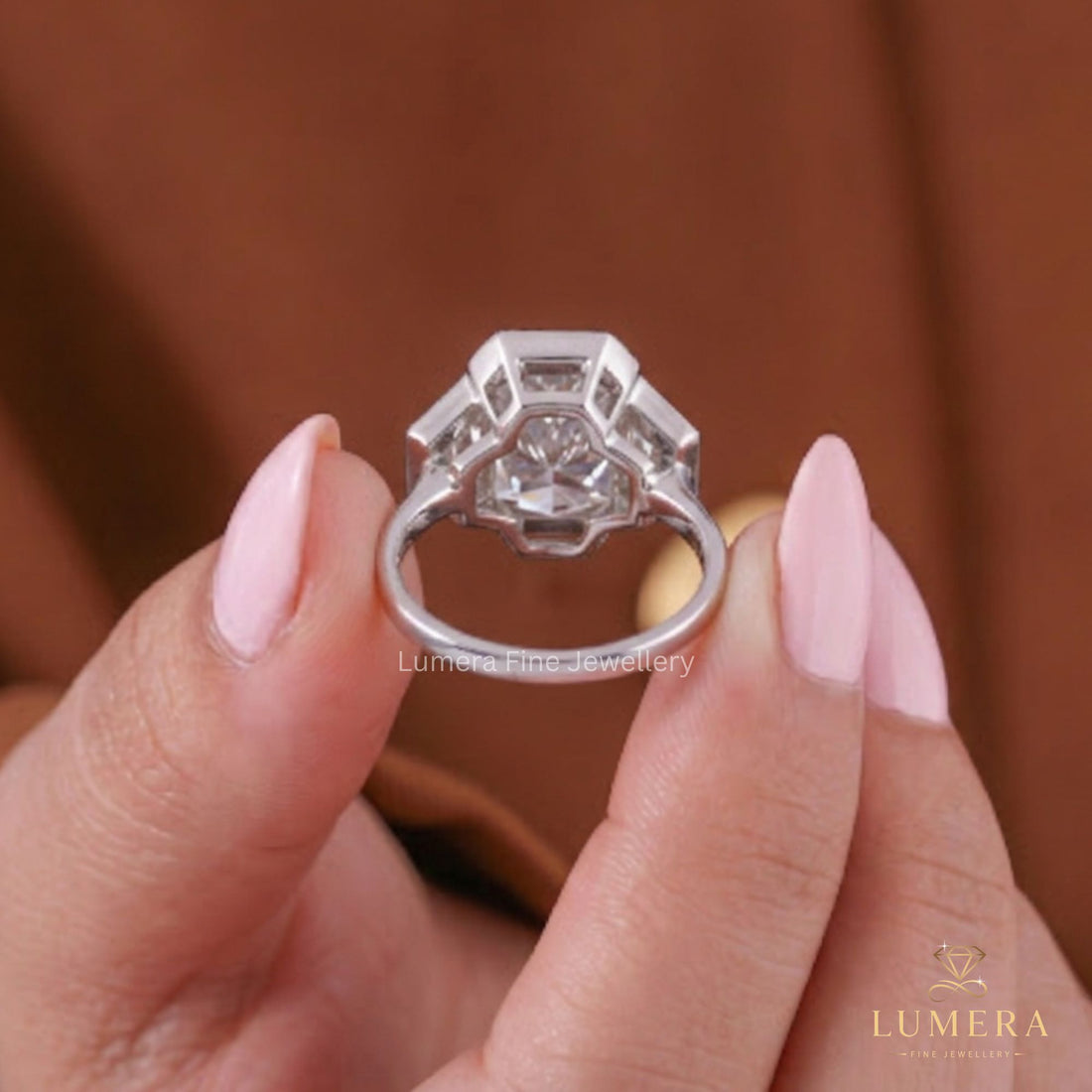 Three stone bezel set featuring a knife edge ring.
