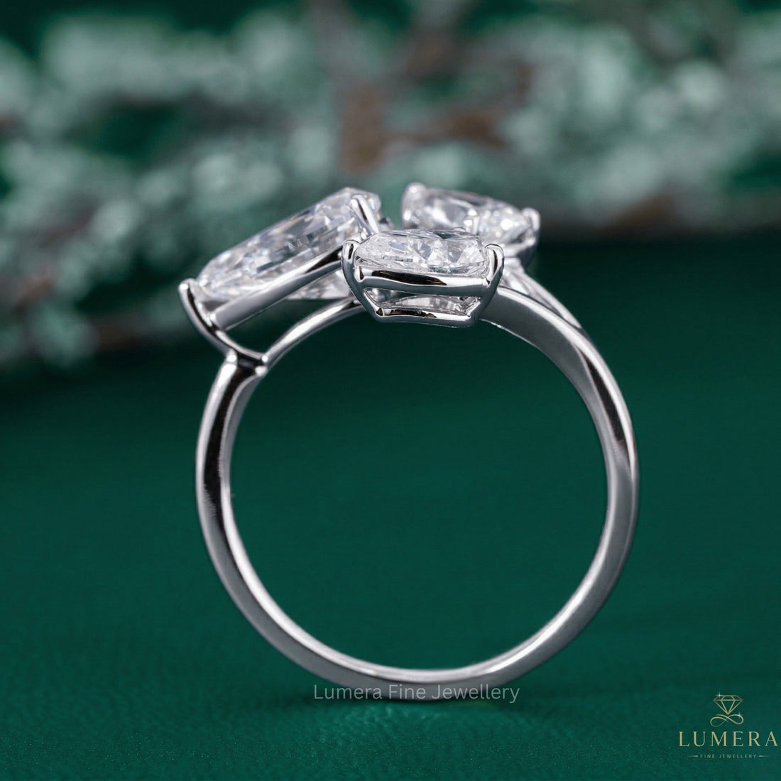 three stone engagement ring with three stone pear ring.