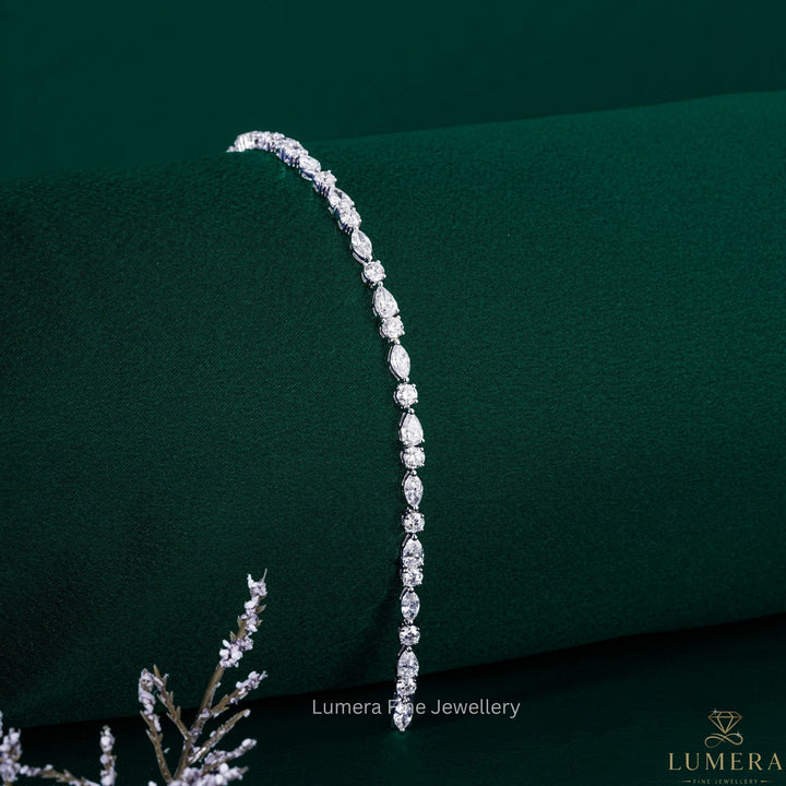 round cut tennis bracelet with marquise tennis bracelet.