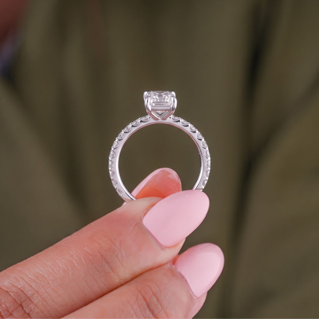 Claw prong setting on a radiant cut engagement ring.
