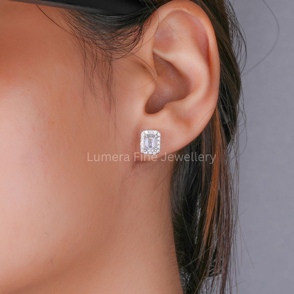 emerald cut stud earrings with halo diamond earrings.
