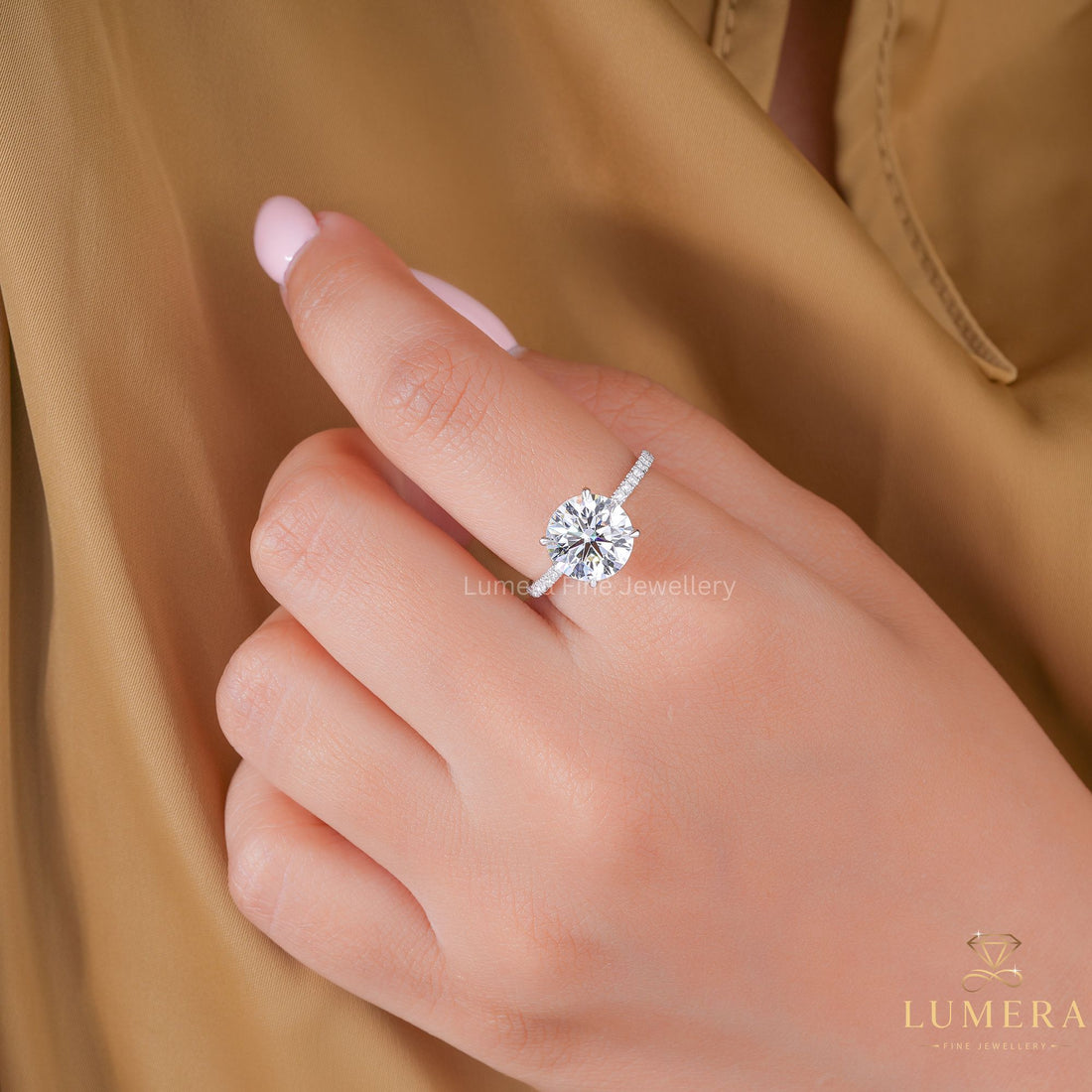 round cut hidden halo ring on pave band.
