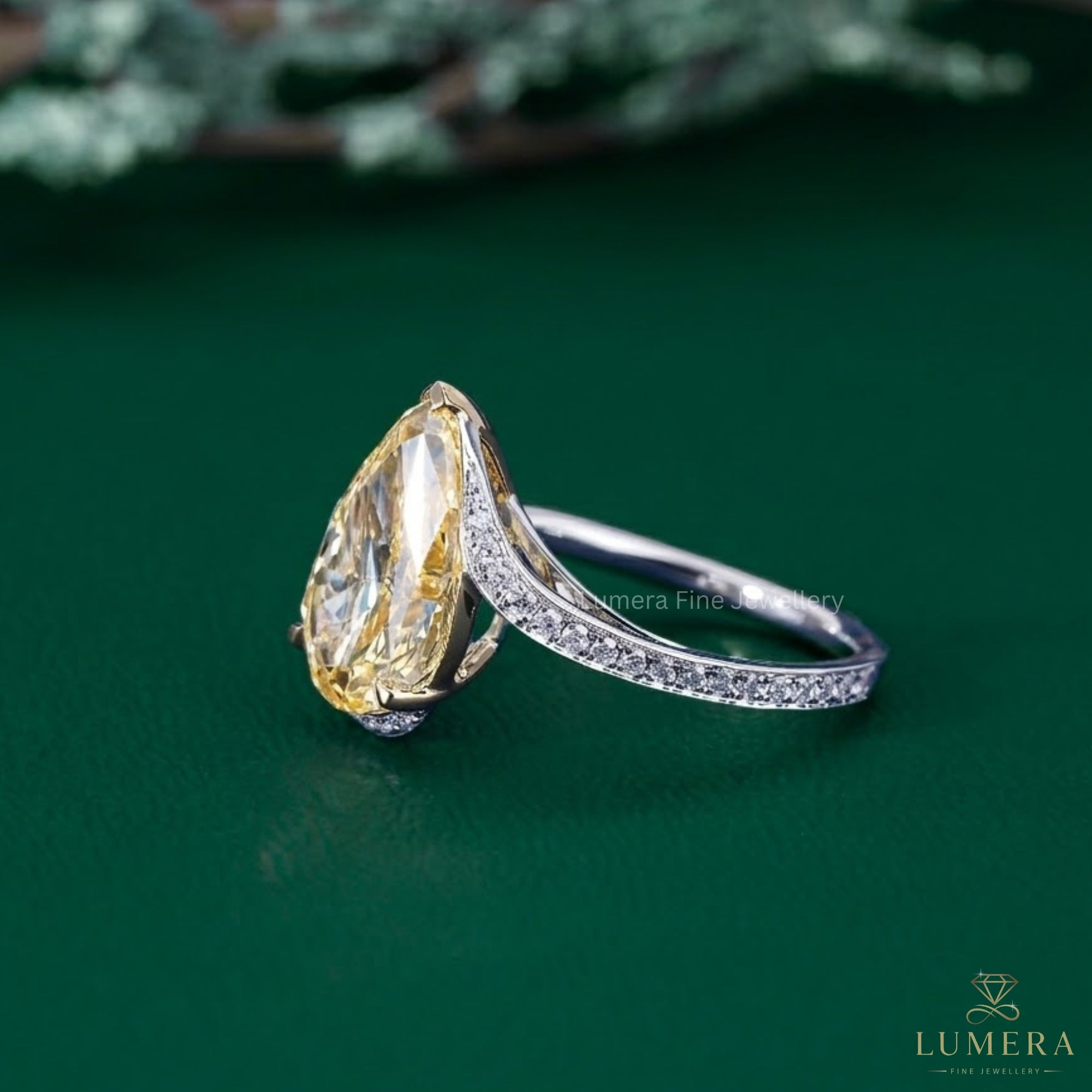 pear shape engagement ring with claw prong setting.