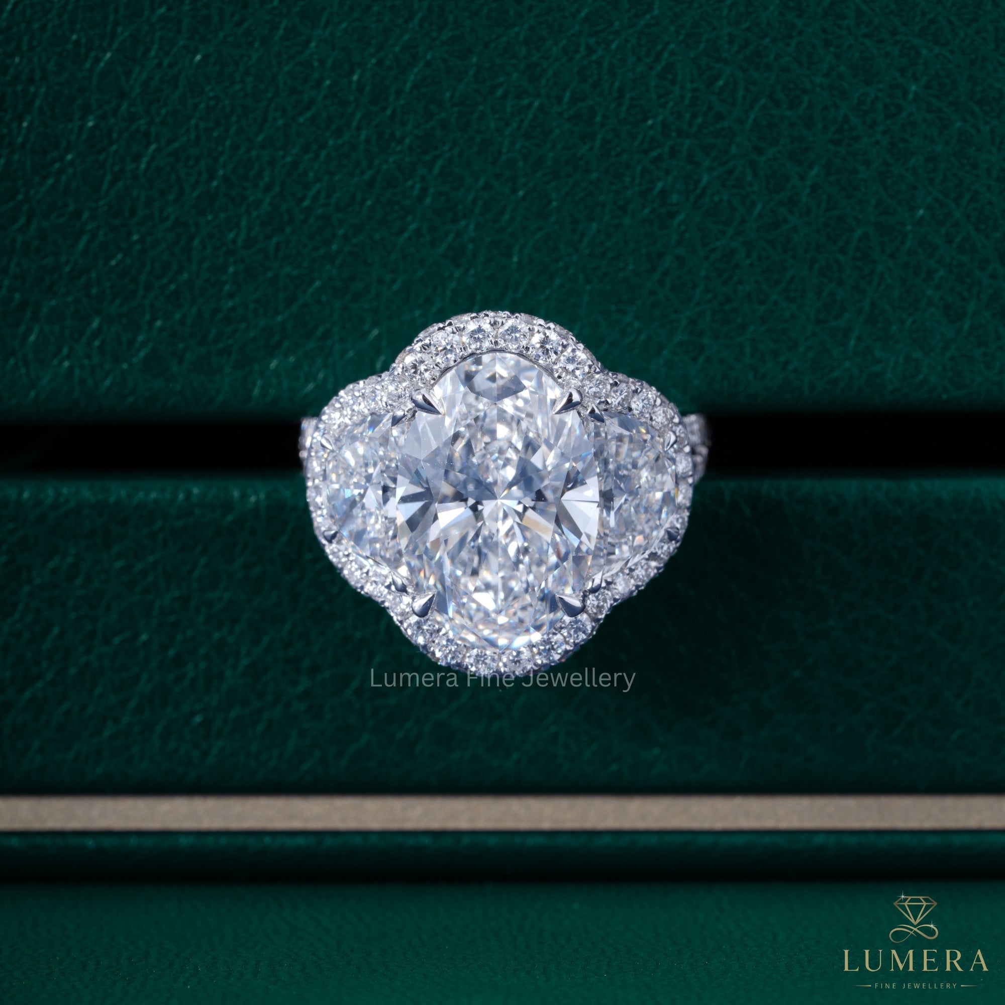 Oval diamond ring with Three stone halo ring.