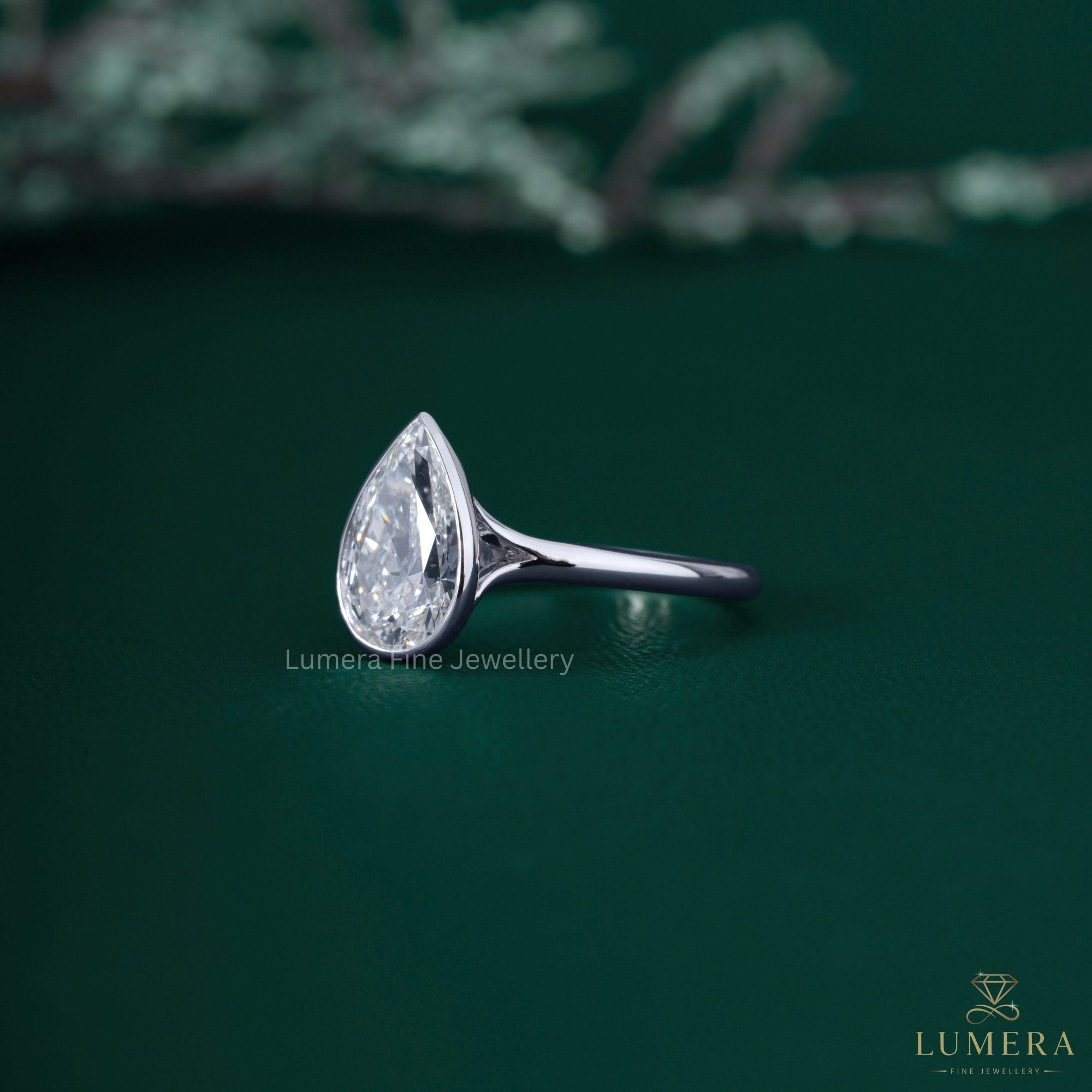 Solitaire bezel ring with bezel setting ring.