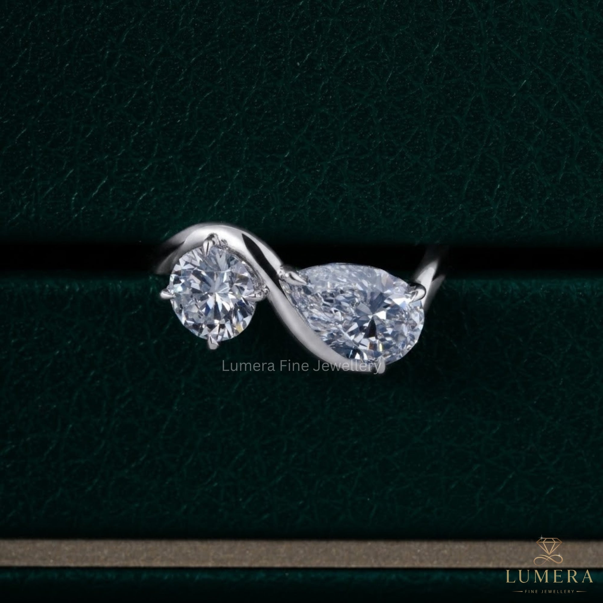 Pear shaped engagement ring with Pear cut ring.
