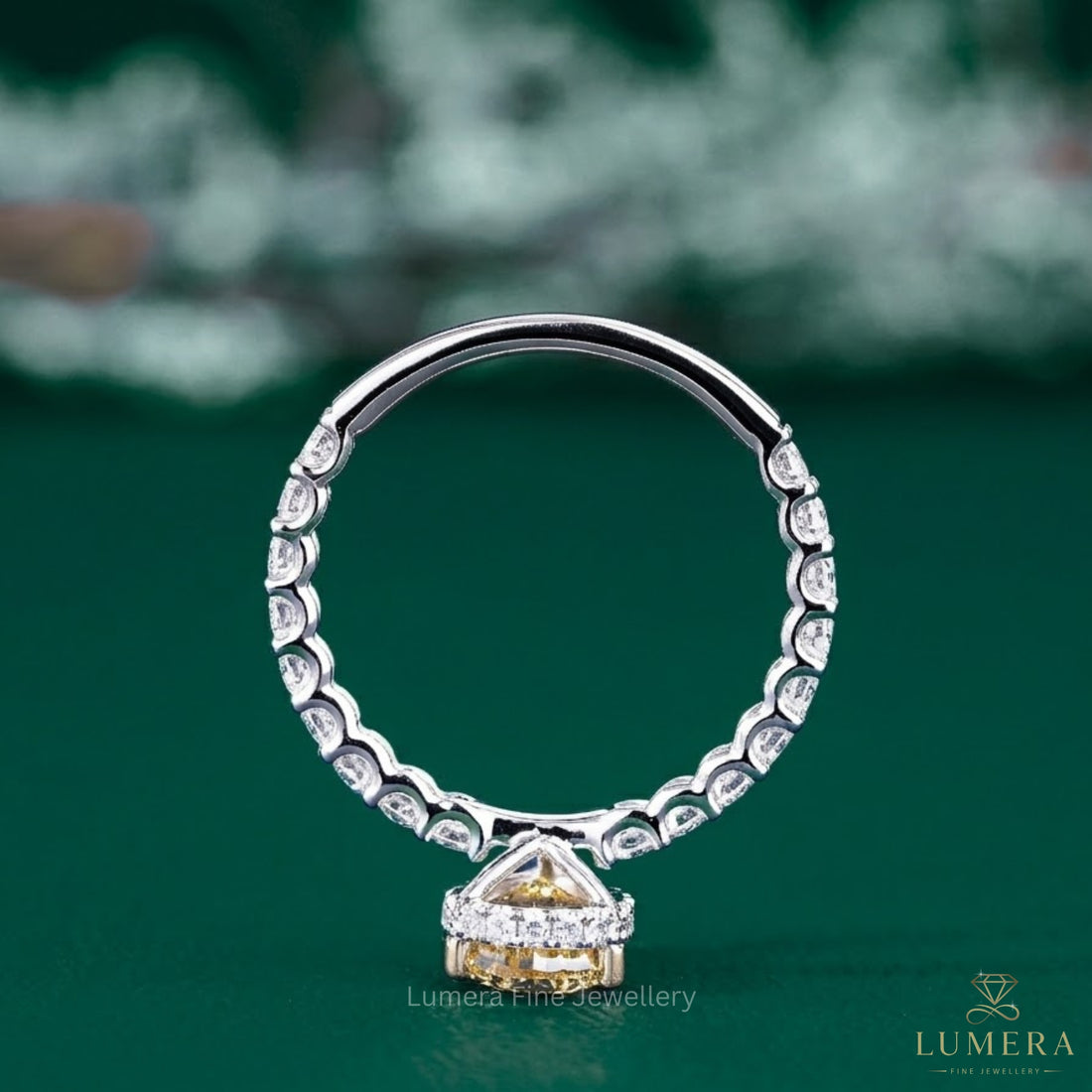 yellow pear shaped diamond ring with colored diamond ring.