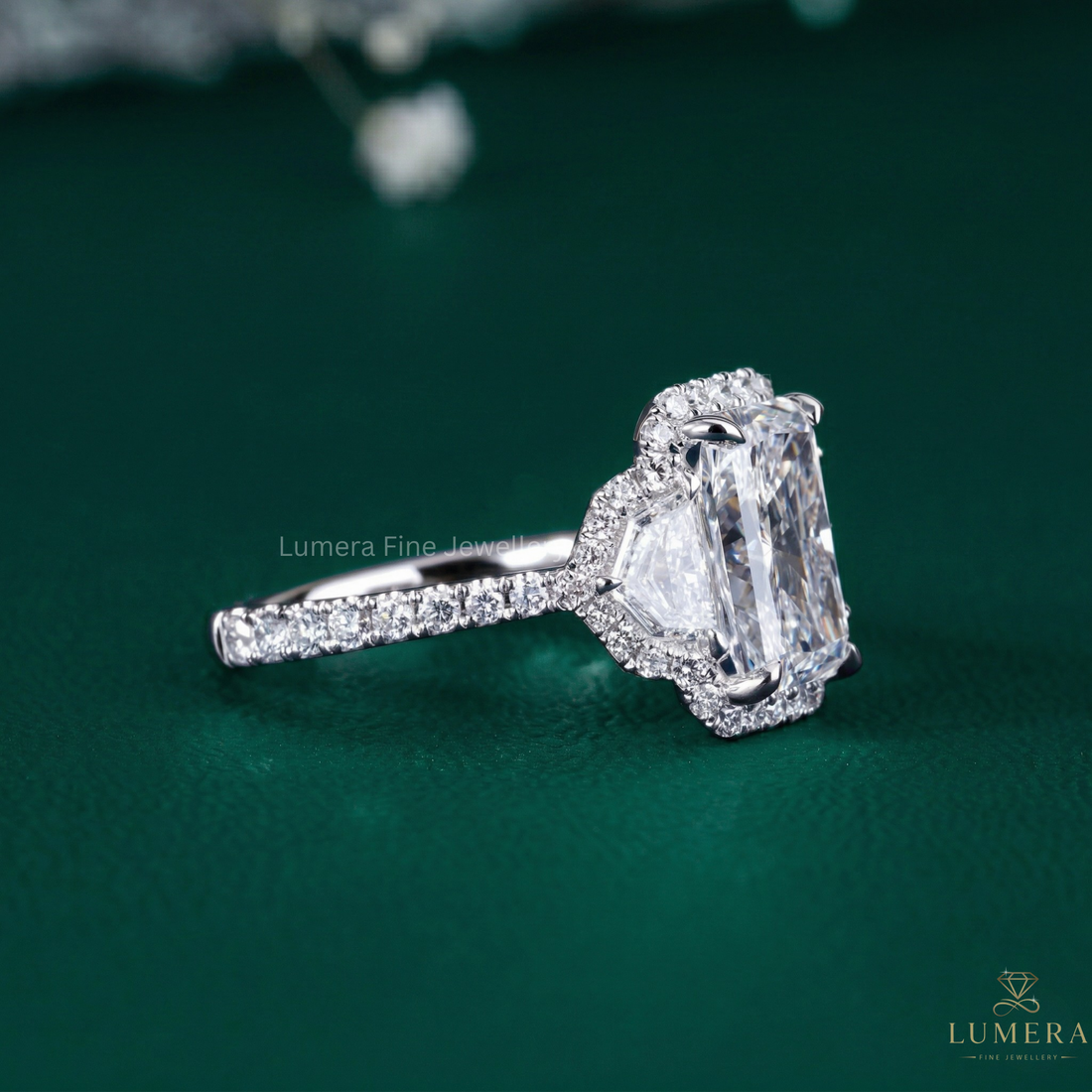 past present future ring with cadillac cut side stones.