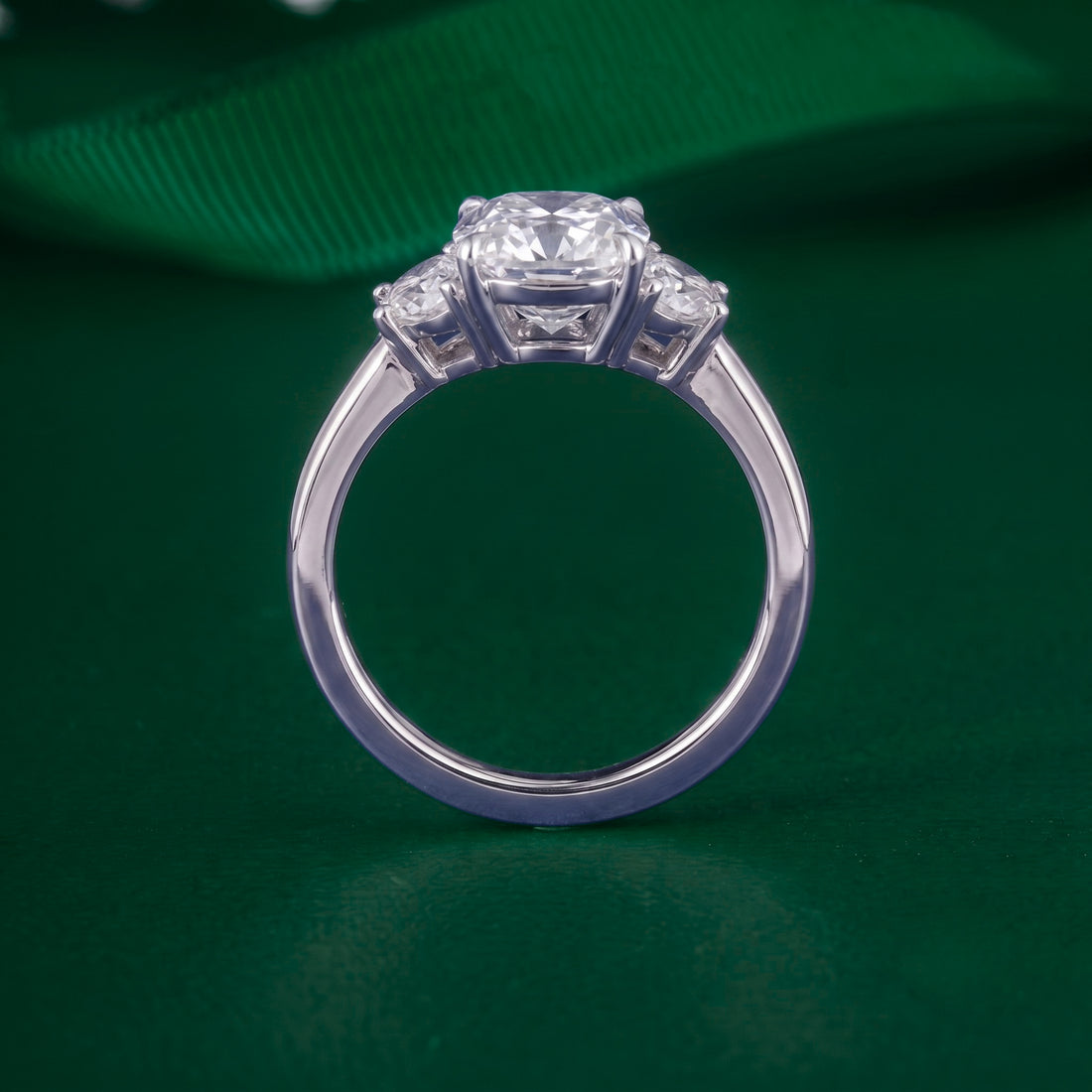 three stone ring with half moon cut side stone.
