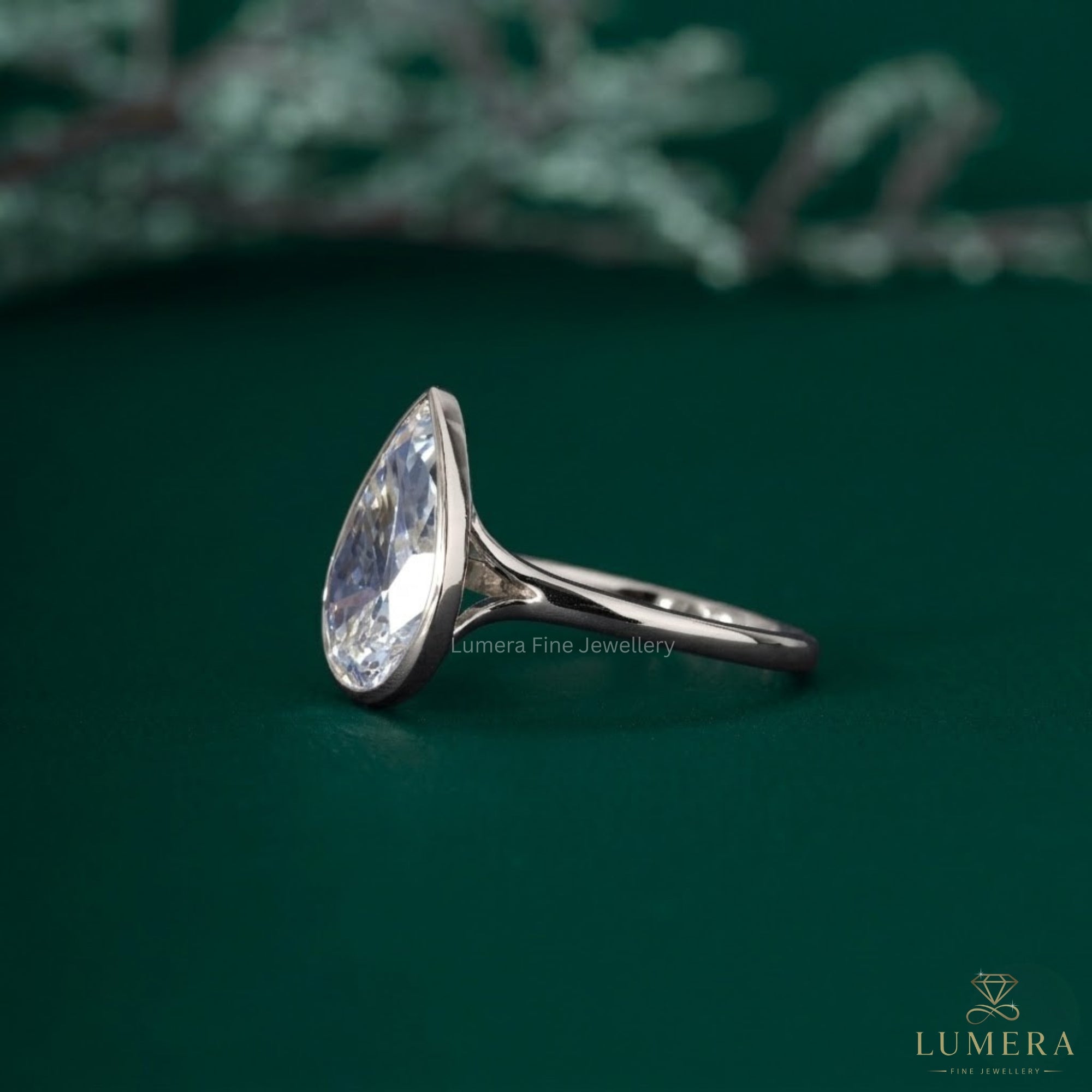 Pear solitaire engagement ring with solitaire pear ring.