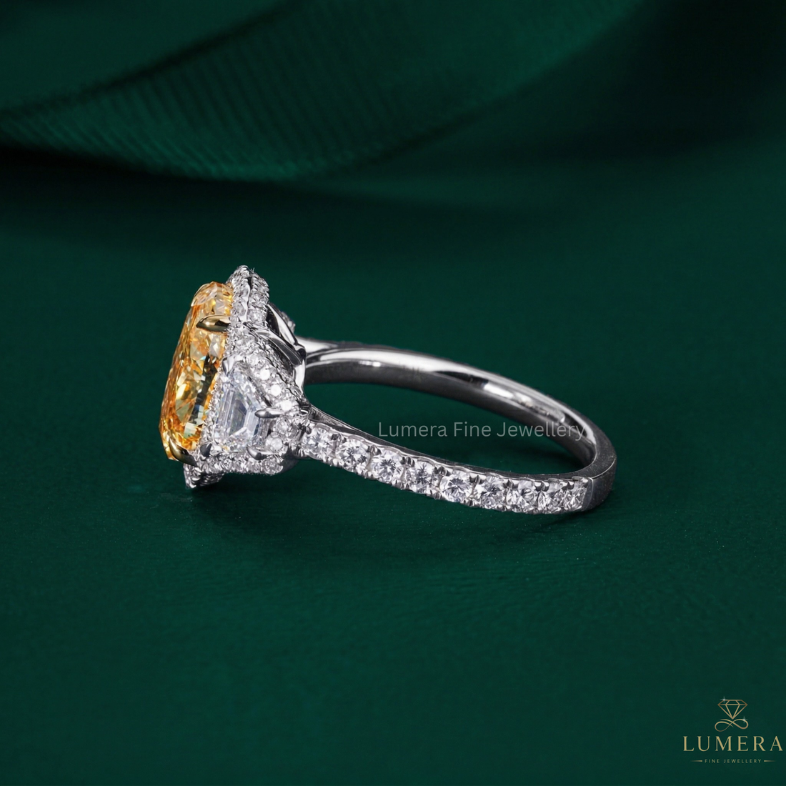 three stone engagement ring with trapezoid side stones.