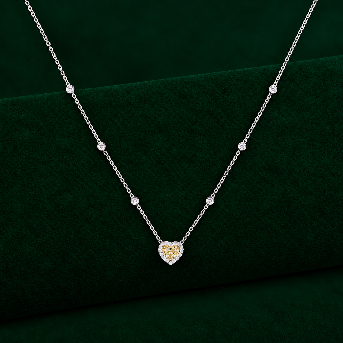 yellow diamond heart pendant with halo diamond pendant.
