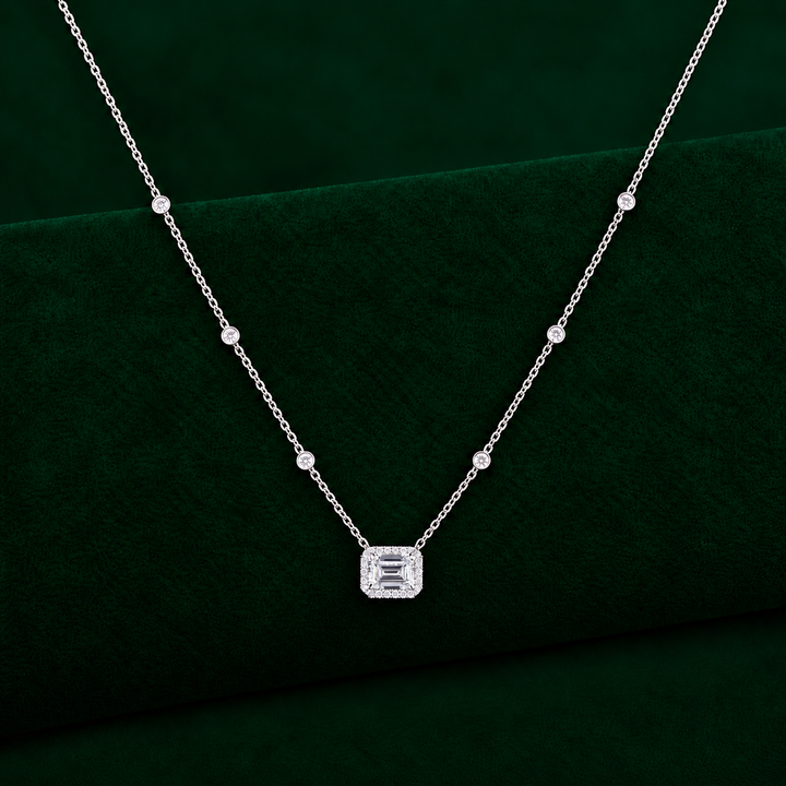 emerald necklace pendant with diamond accent chain.
