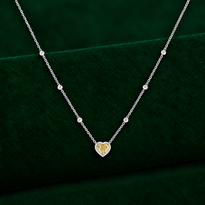 halo pendant with minimalist heart collar chain.
