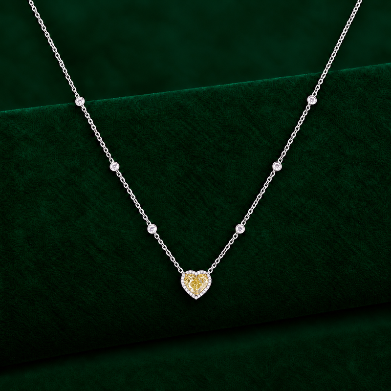 halo pendant with minimalist heart collar chain.
