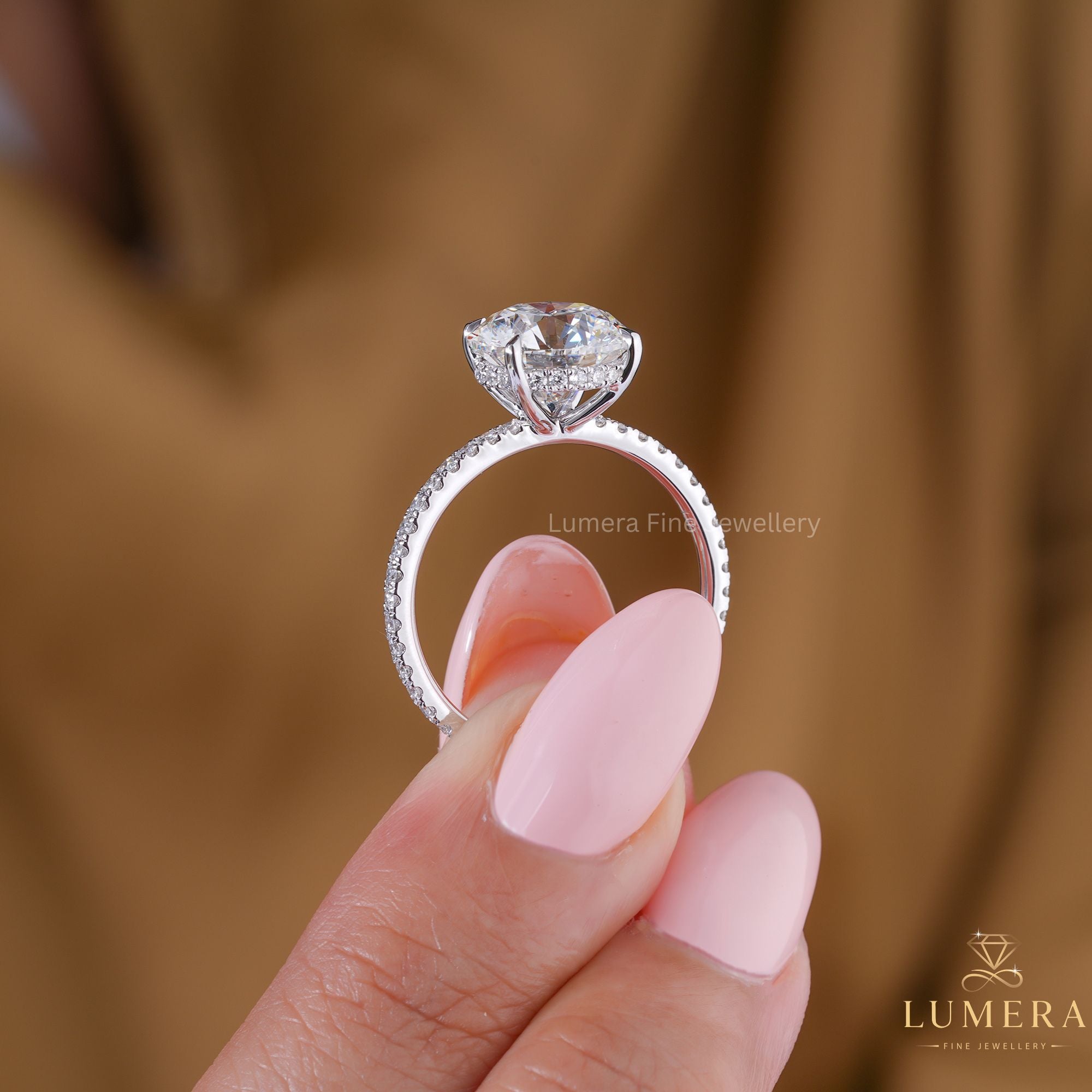 round cut engagement ring with hidden halo setting ring.
