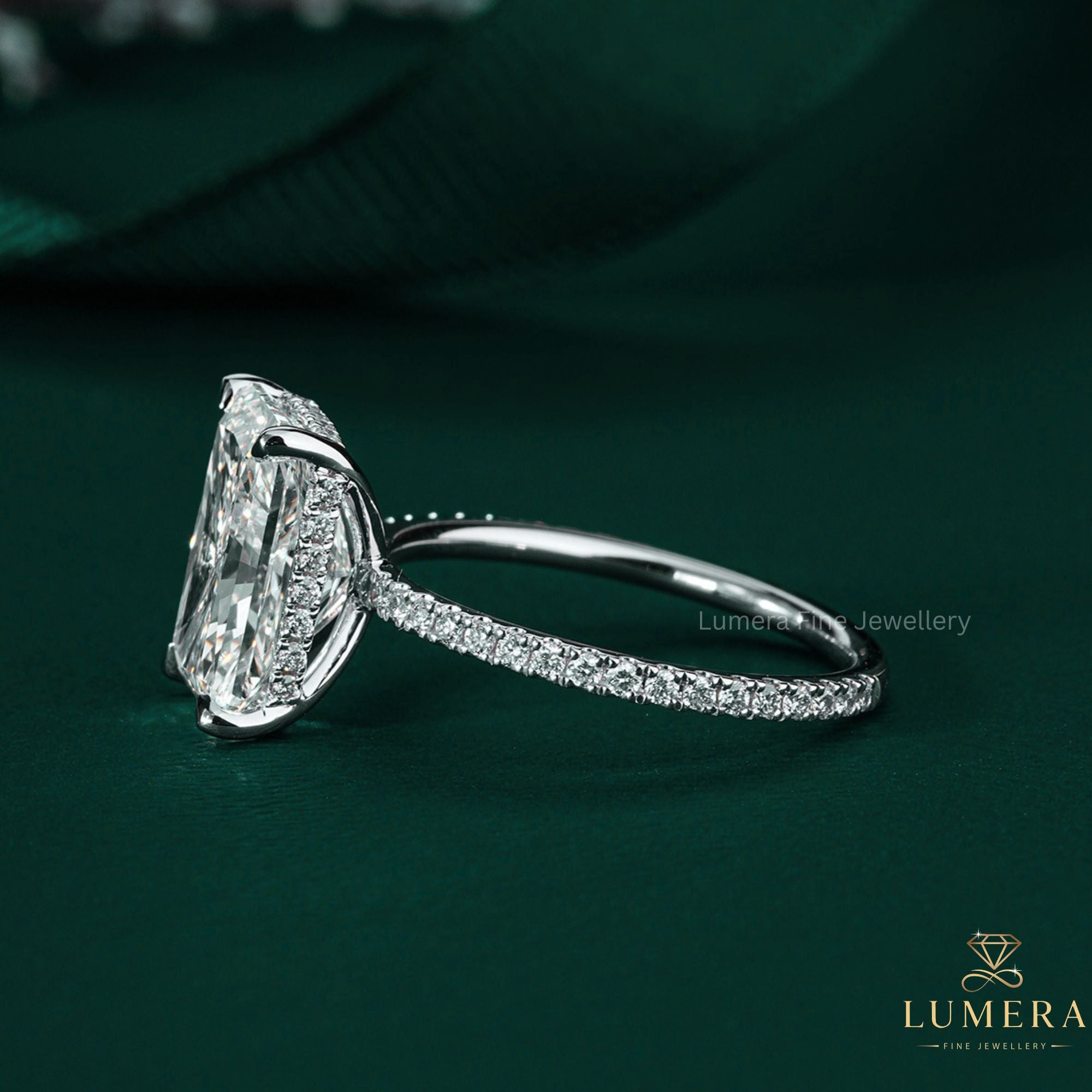 radiant cut engagement ring on hidden halo ring.
