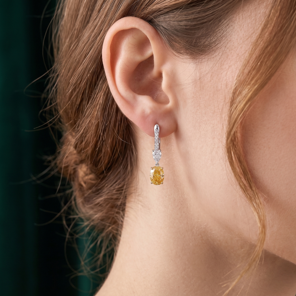 pear cut earrings with yellow oval diamond earrings.
