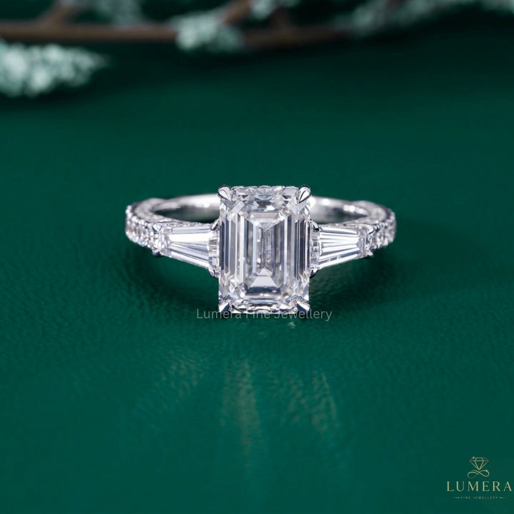 emerald shape engagement ring with hidden halo diamond ring.