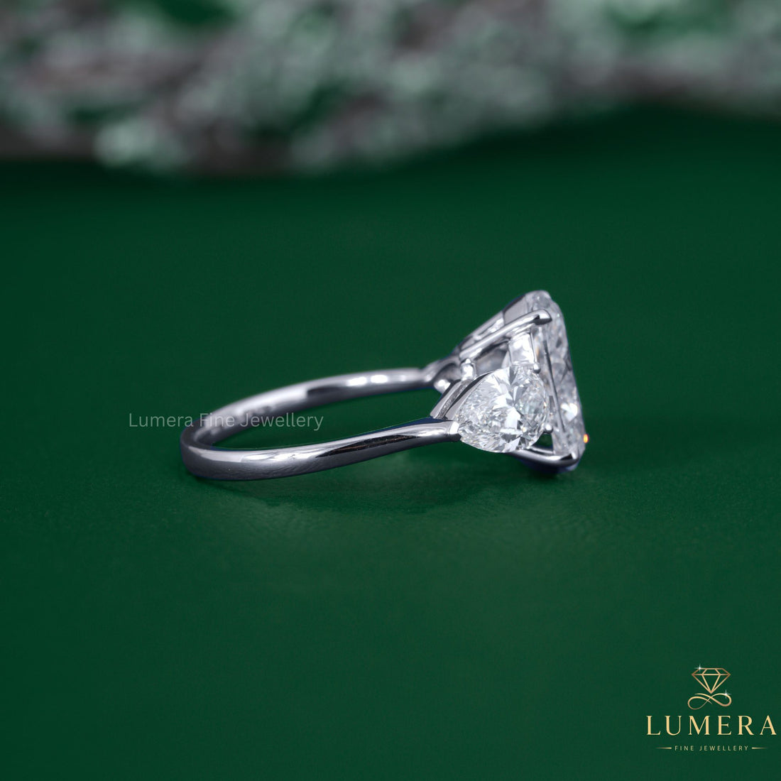 Trilogy ring with three stone ring.
