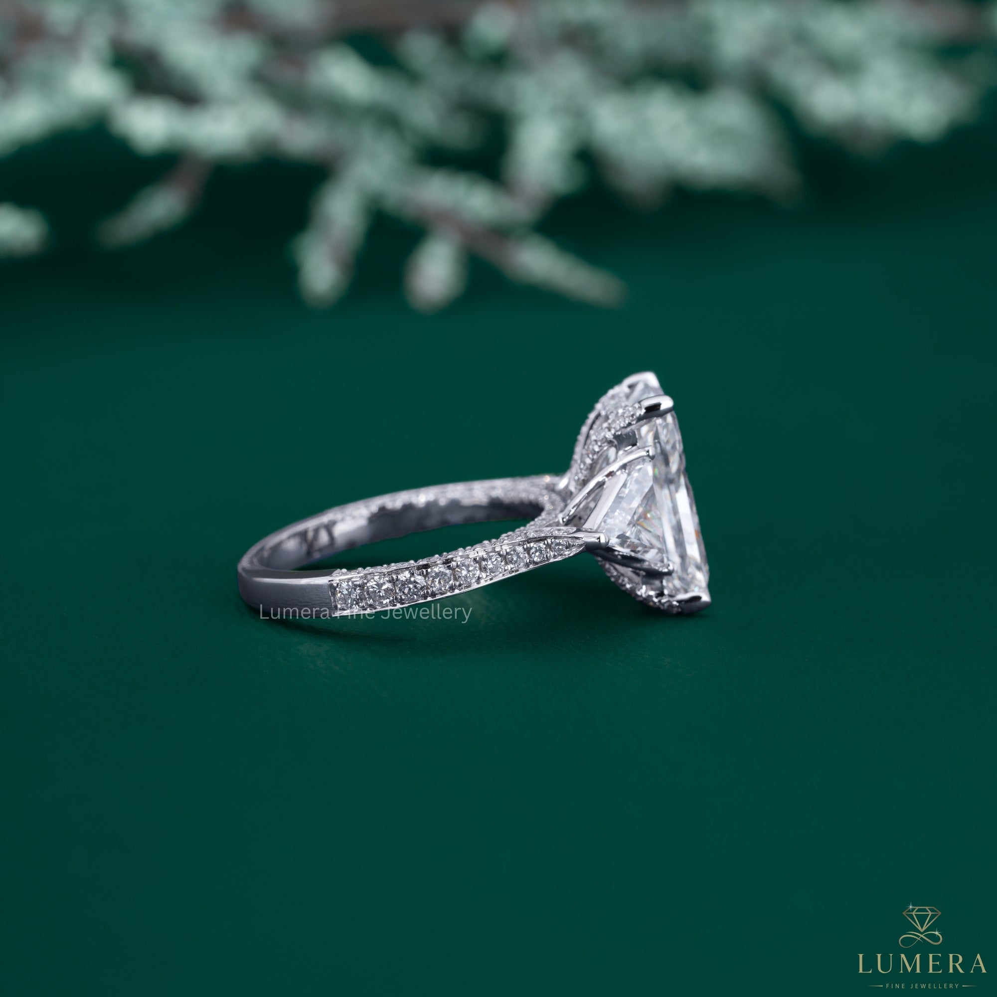 Radiant cut ring with trilliant cut diamond ring.