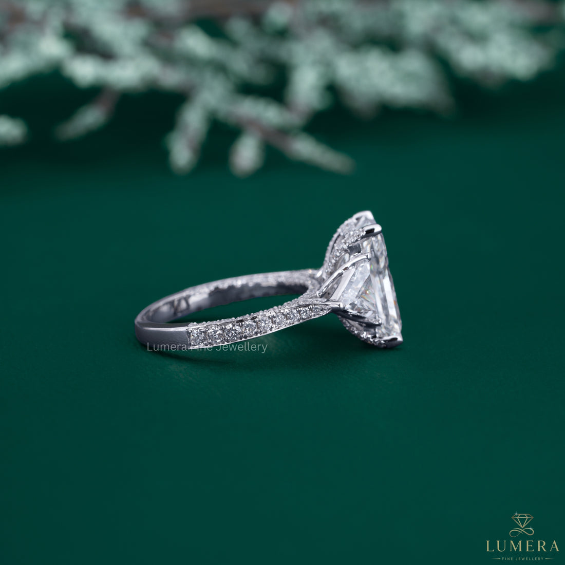 Radiant cut ring with trilliant cut diamond ring.