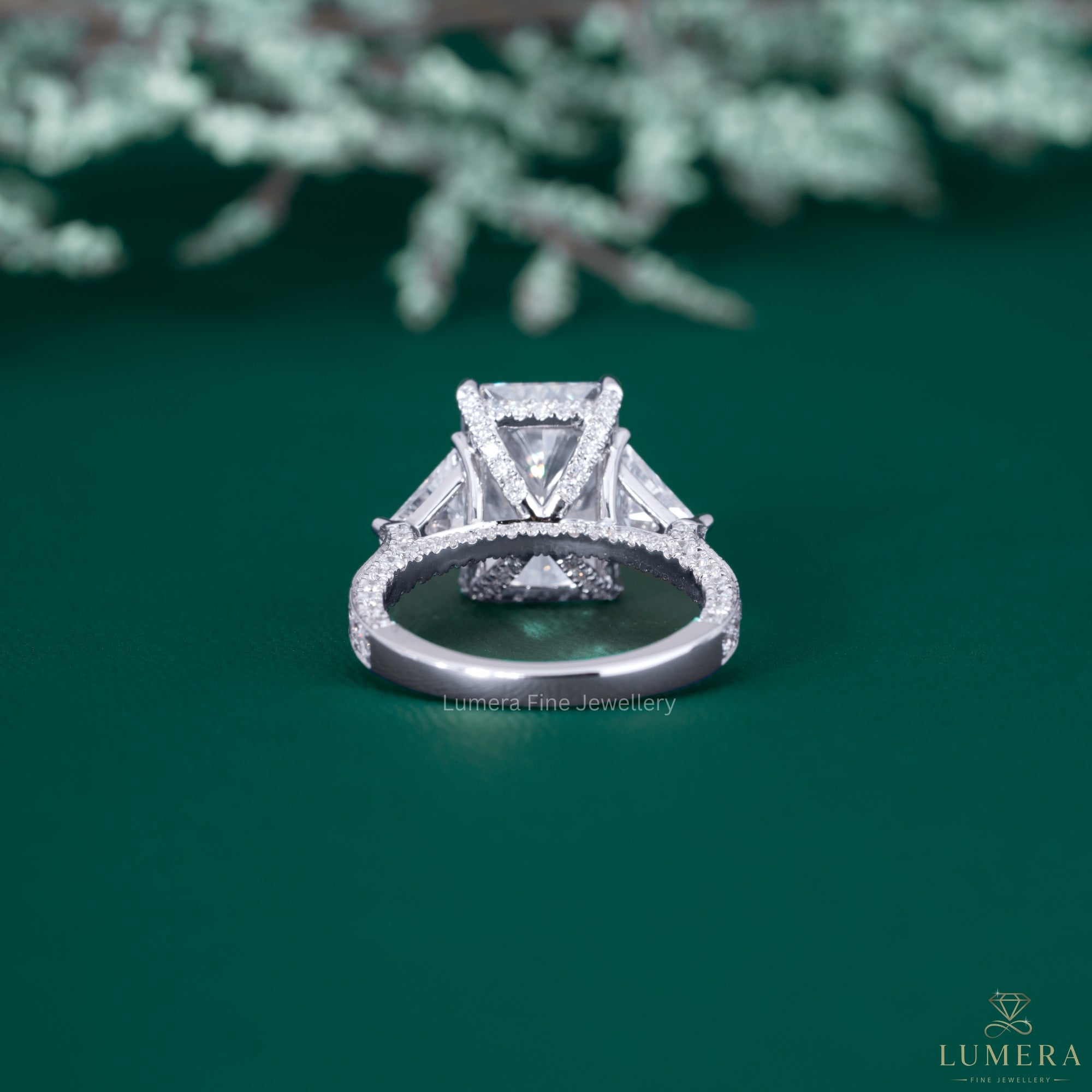 Radiant engagement ring with hide stone ring.