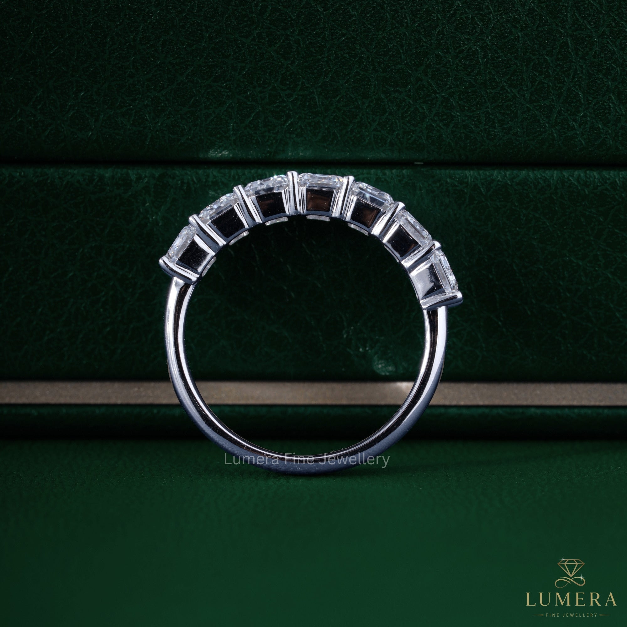 Round prong band setting with solid gold band.