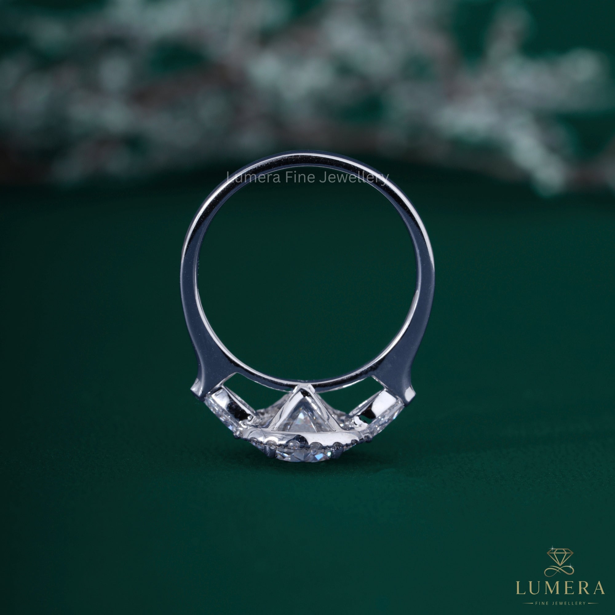 Round diamond engagement ring with claw prong ring.