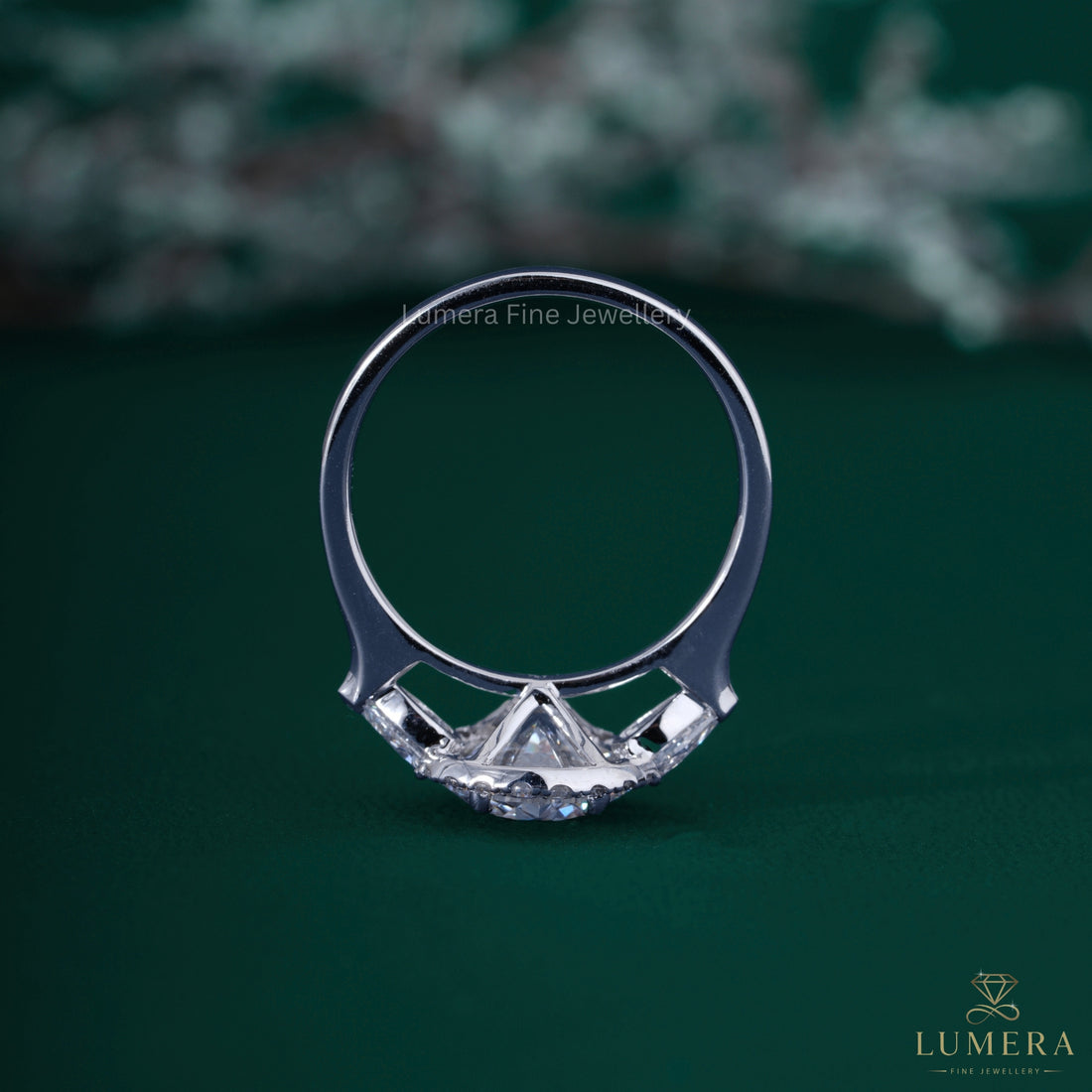 Round diamond engagement ring with claw prong ring.