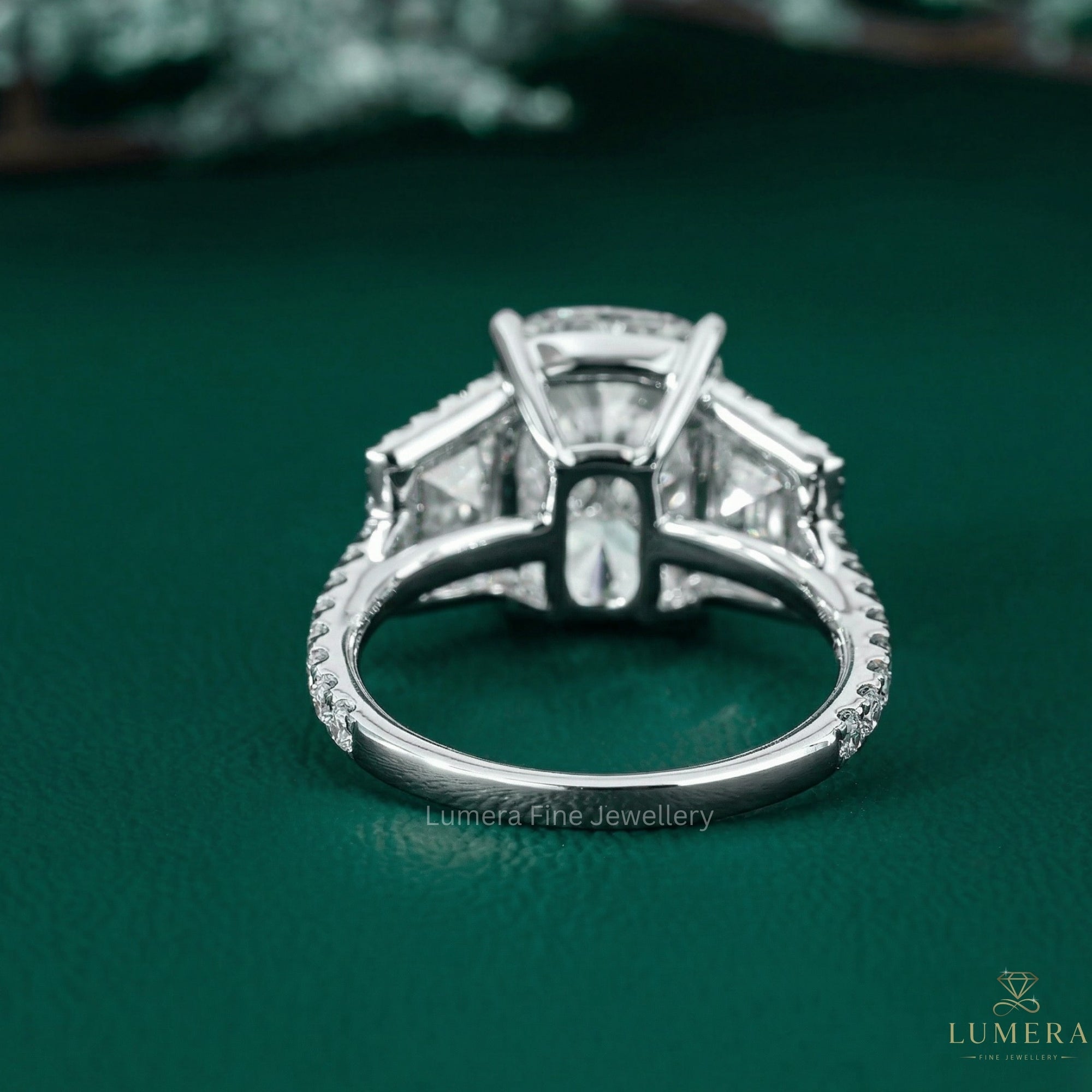 Cushion Diamond Engagement Ring with trapezoid side stone.