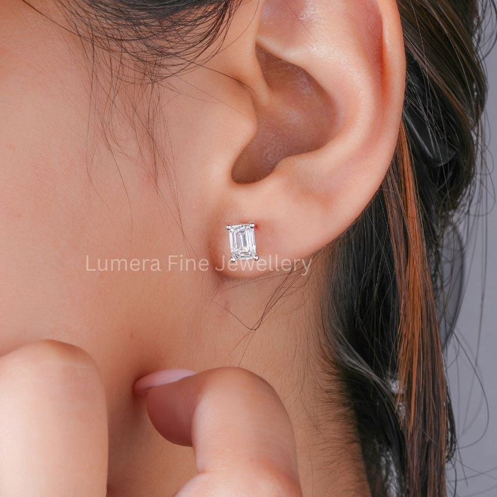 lumera earrings with emerald cut solitaire earrings.
