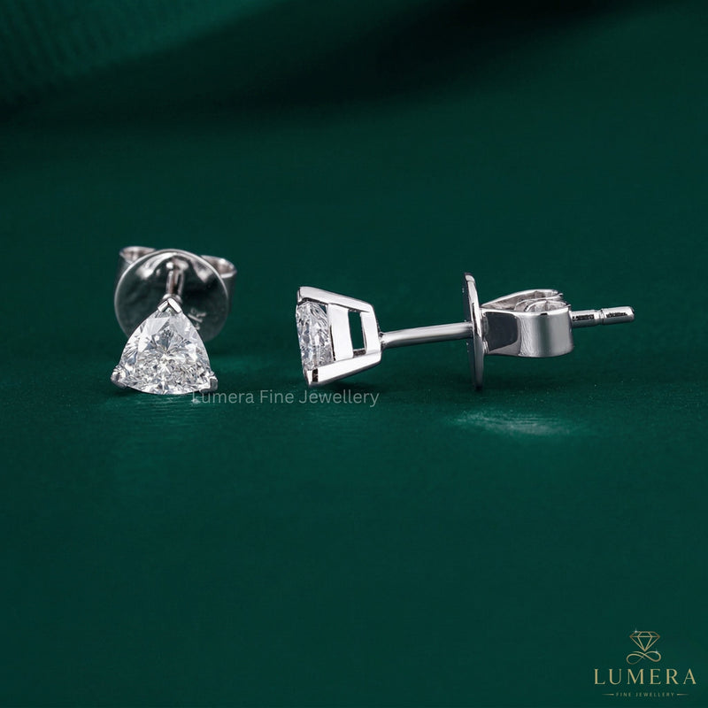 trillion cut earrings with basket setting ring.
