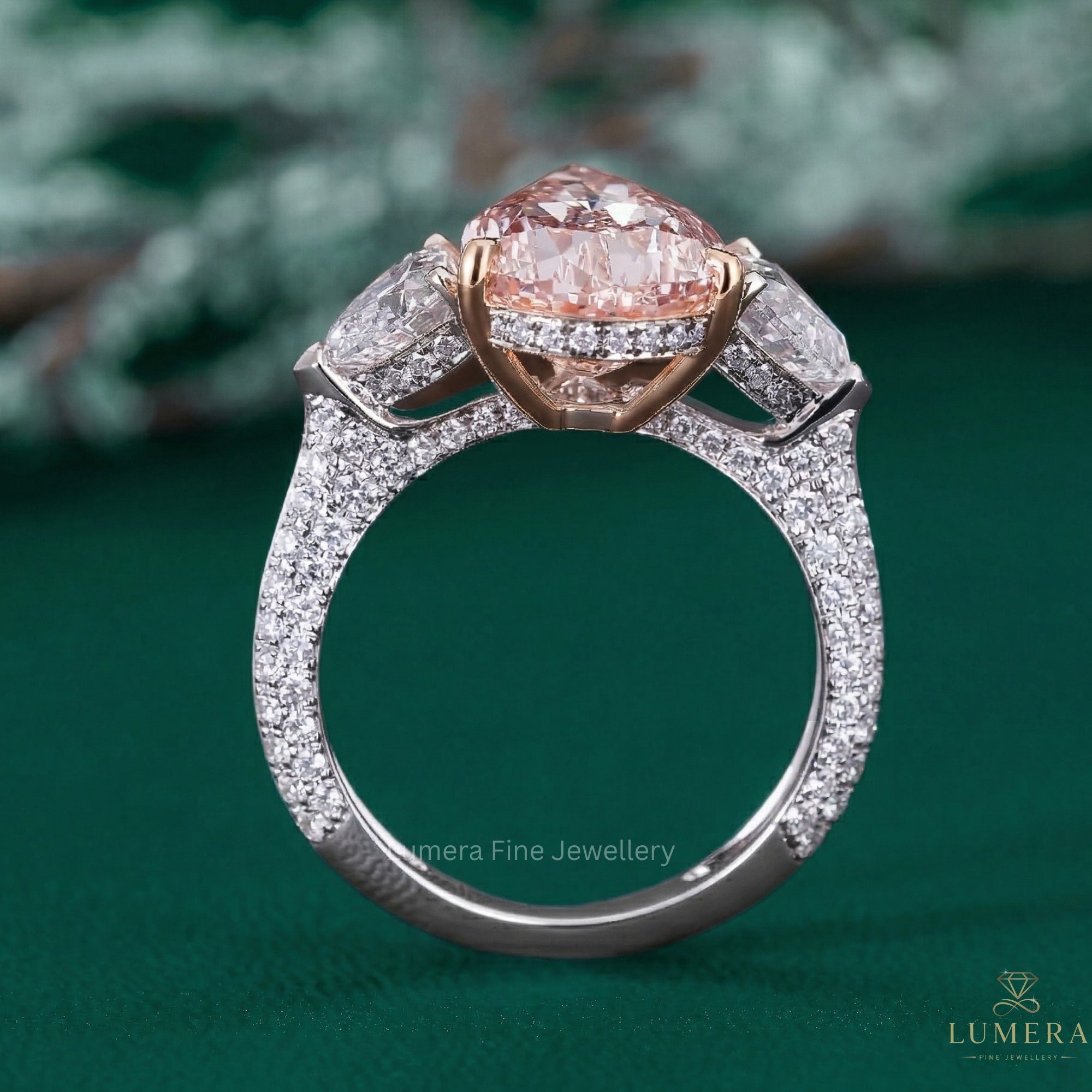 pear engagement ring with heart side stone ring.