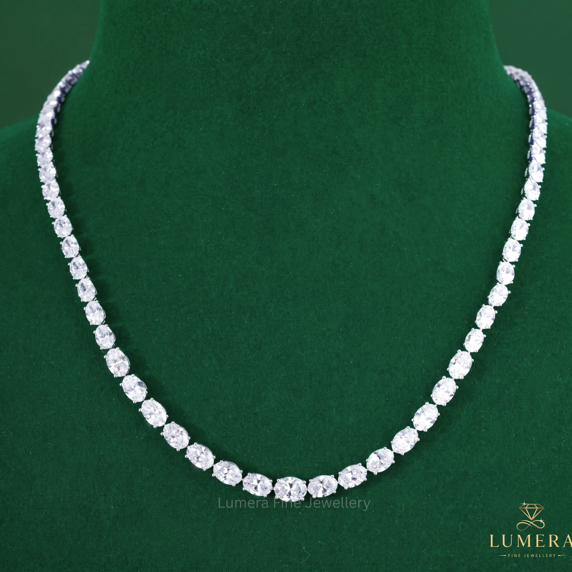 Tennis diamond necklace featuring an oval diamond necklace.