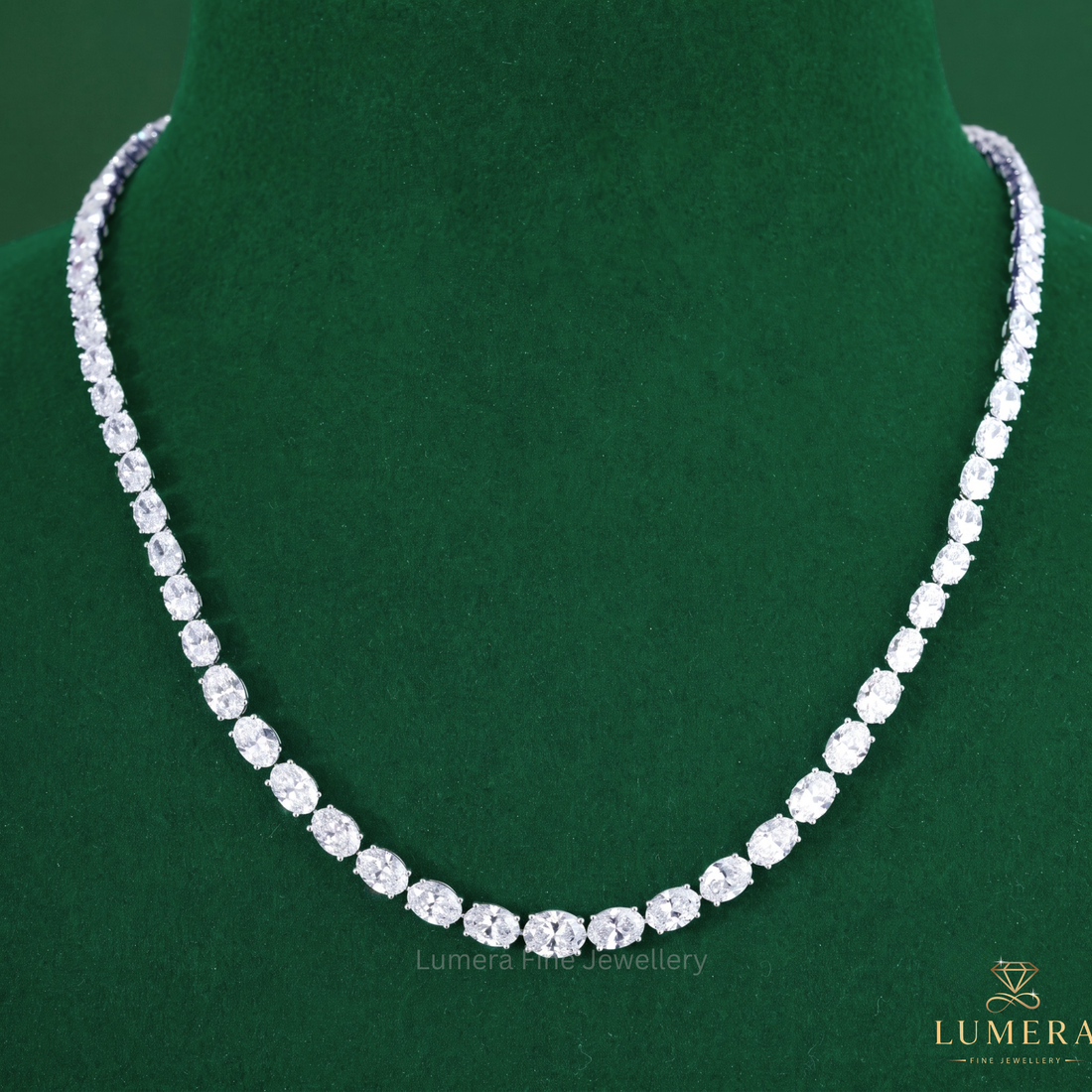 Tennis diamond necklace featuring an oval diamond necklace.