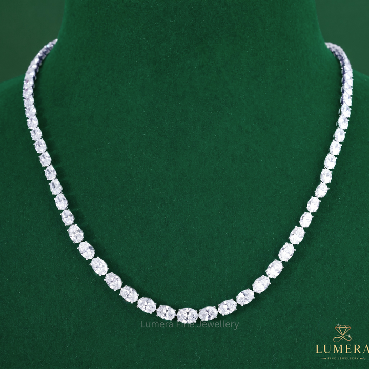 Tennis diamond necklace featuring an oval diamond necklace.