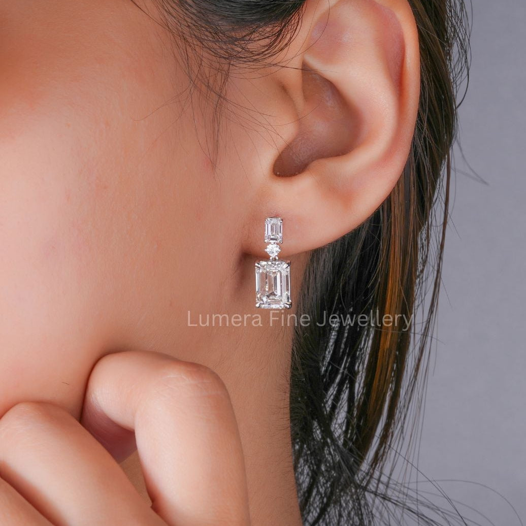 emerald drop earrings with solid gold earrings.
