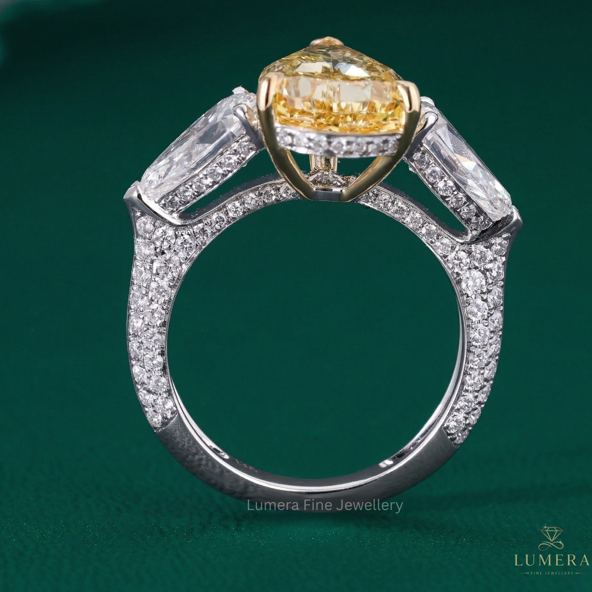 yellow diamond engagement ring with three stone engagement ring.