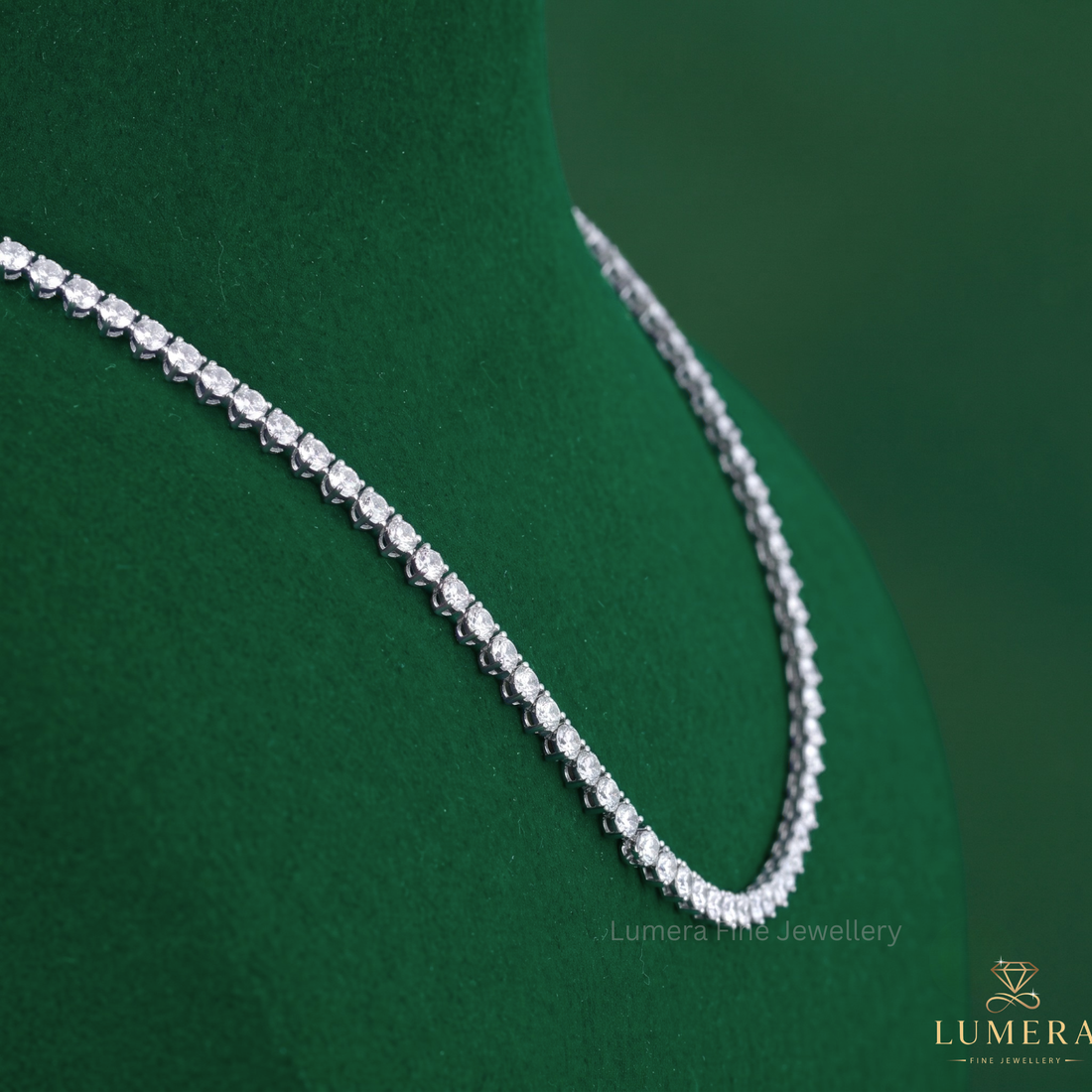 Prong setting paired with a stackable setting necklace.