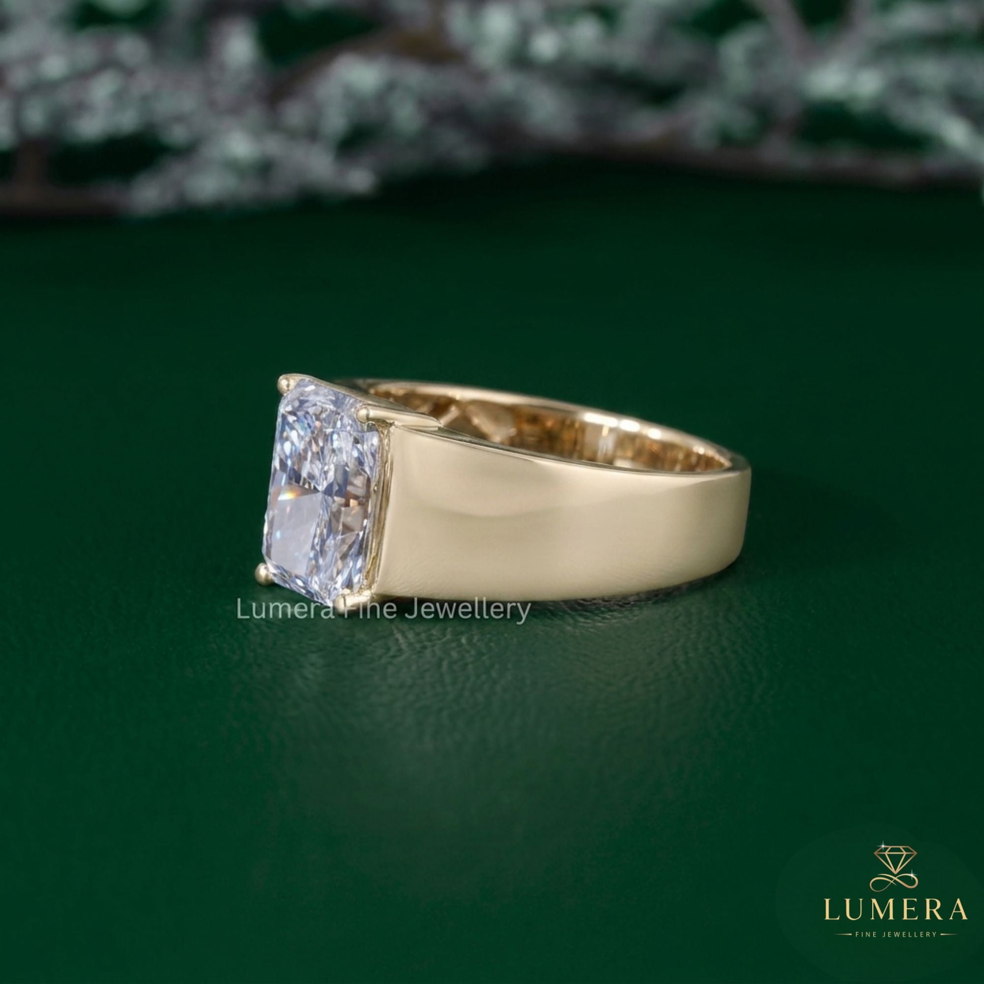 radiant cut solitaire engagement ring with tapered shank setting.
