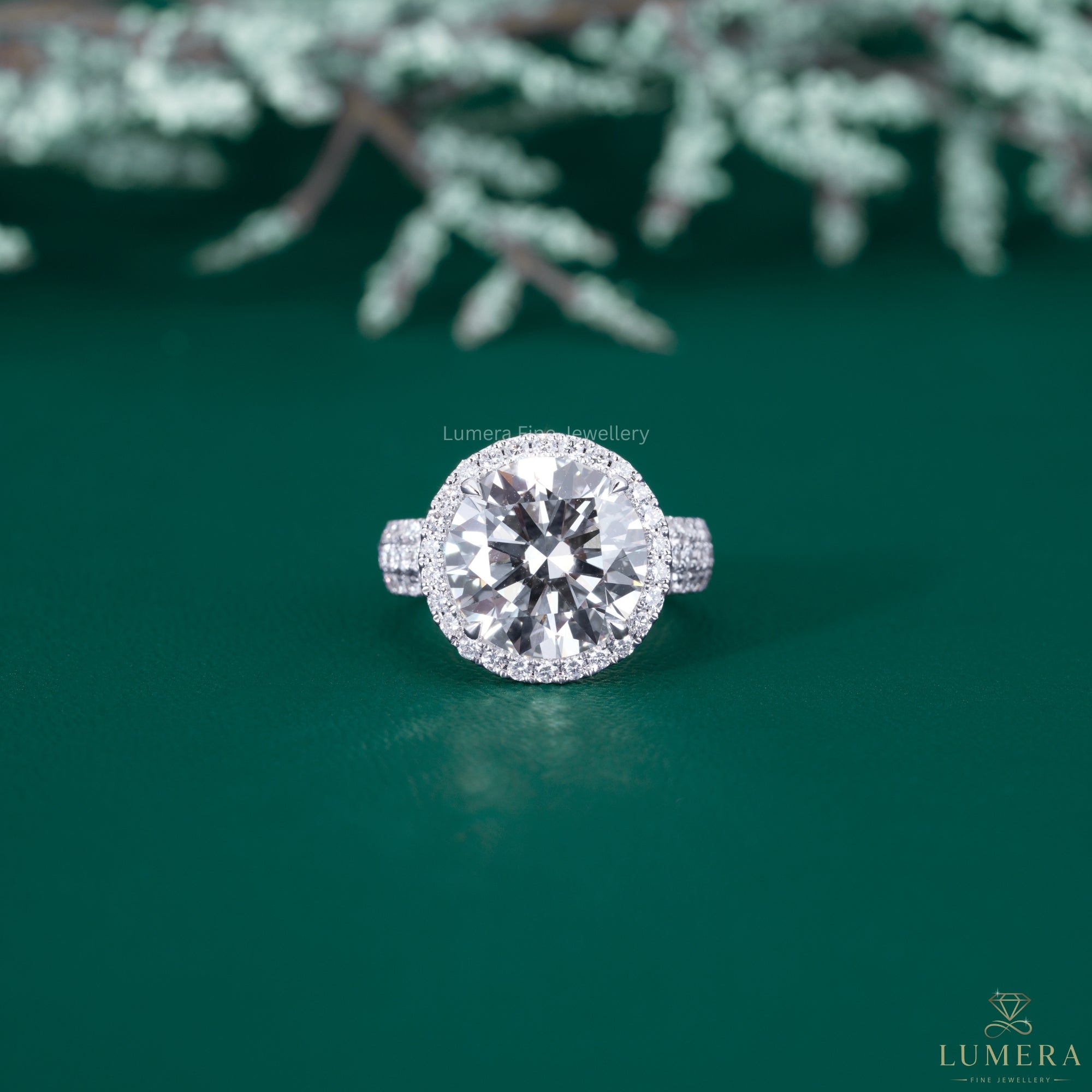 Round diamond engagement ring with round cut halo ring.