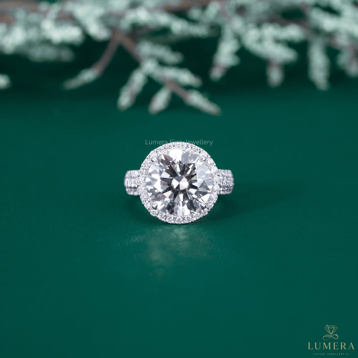 Round diamond engagement ring with round cut halo ring.
