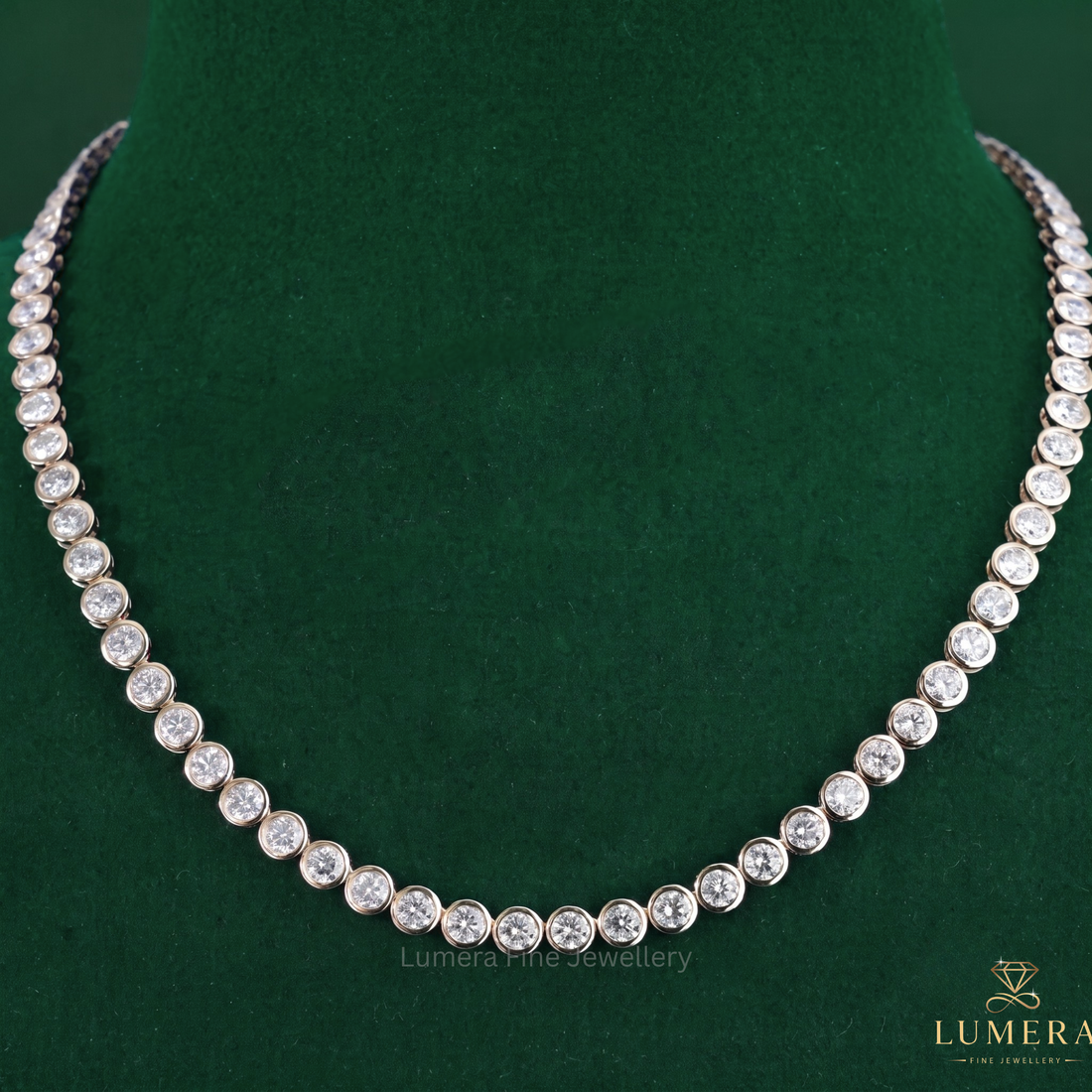 Bezel set diamond tennis necklace paired with a solid gold necklace.
